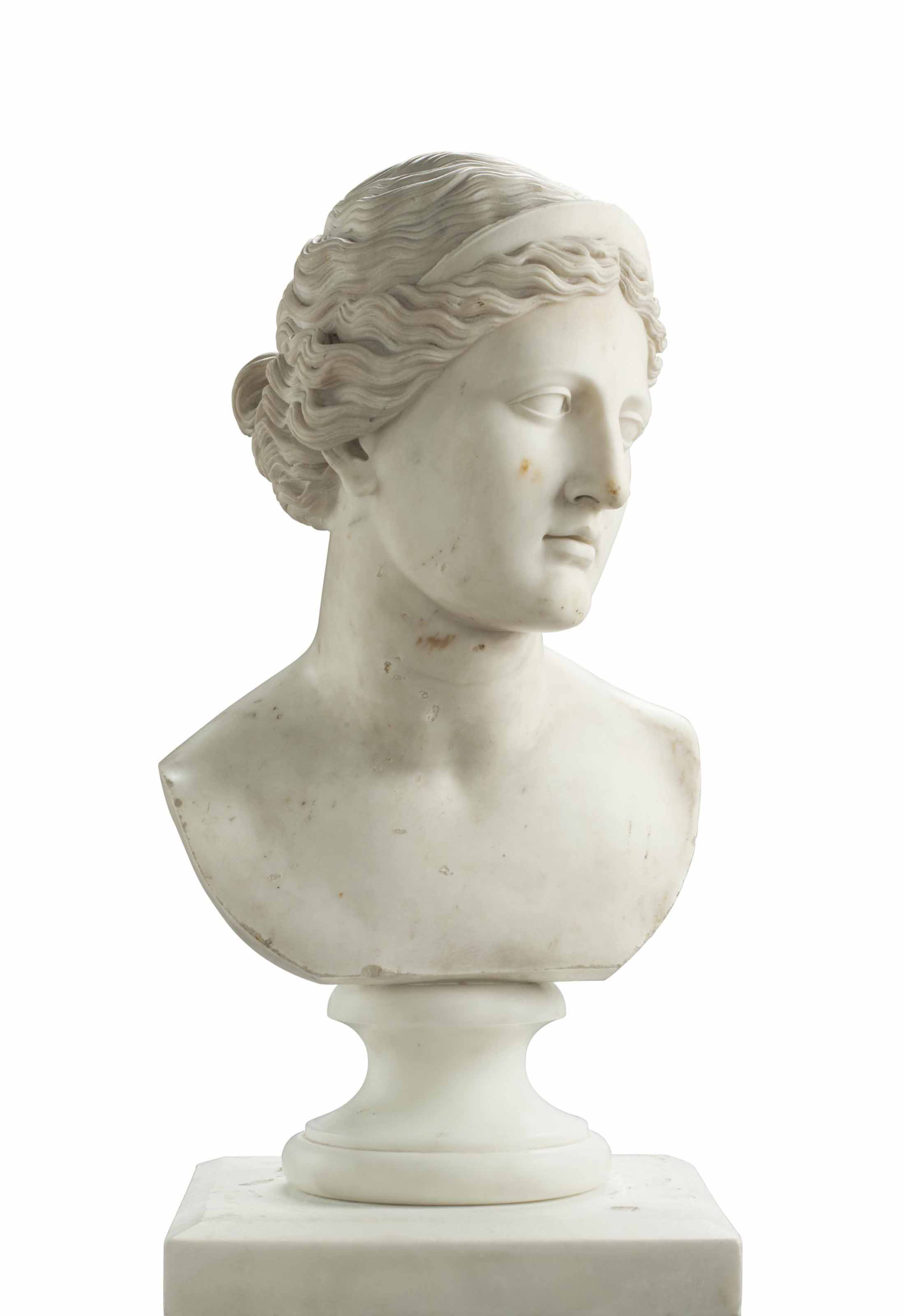 A CARVED MARBLE BUST OF A WOMAN