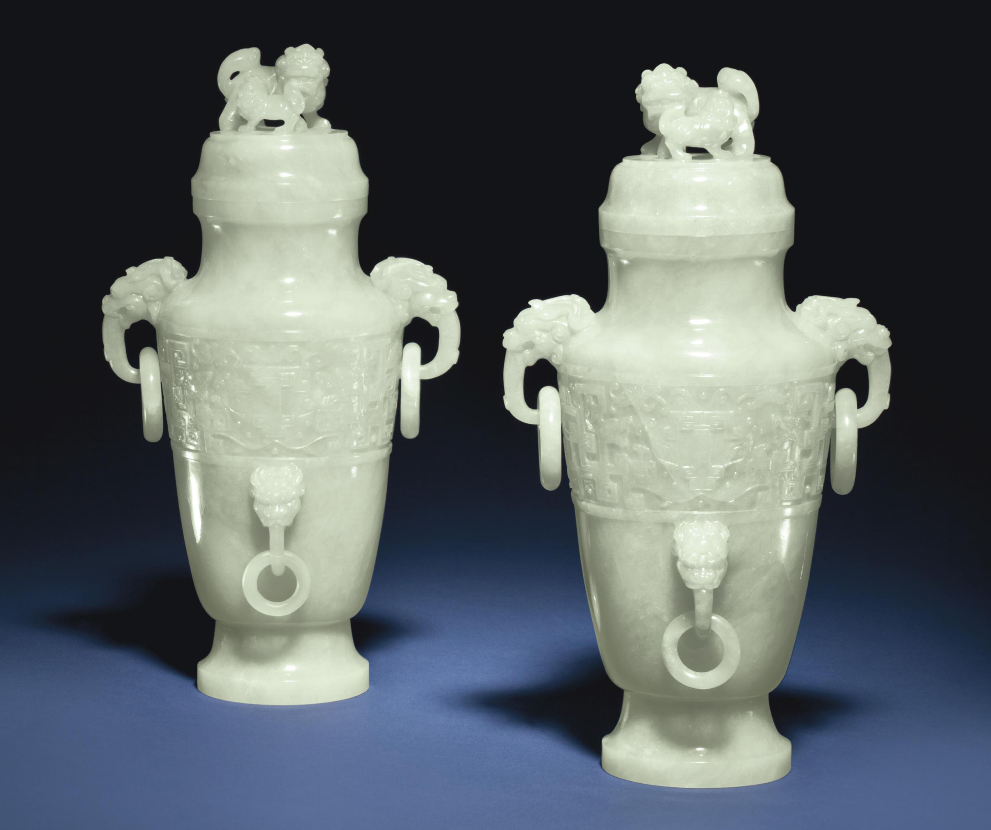 A PAIR OF PALE GREENISHWHITE JADEITE VASES AND COVERS Christie's
