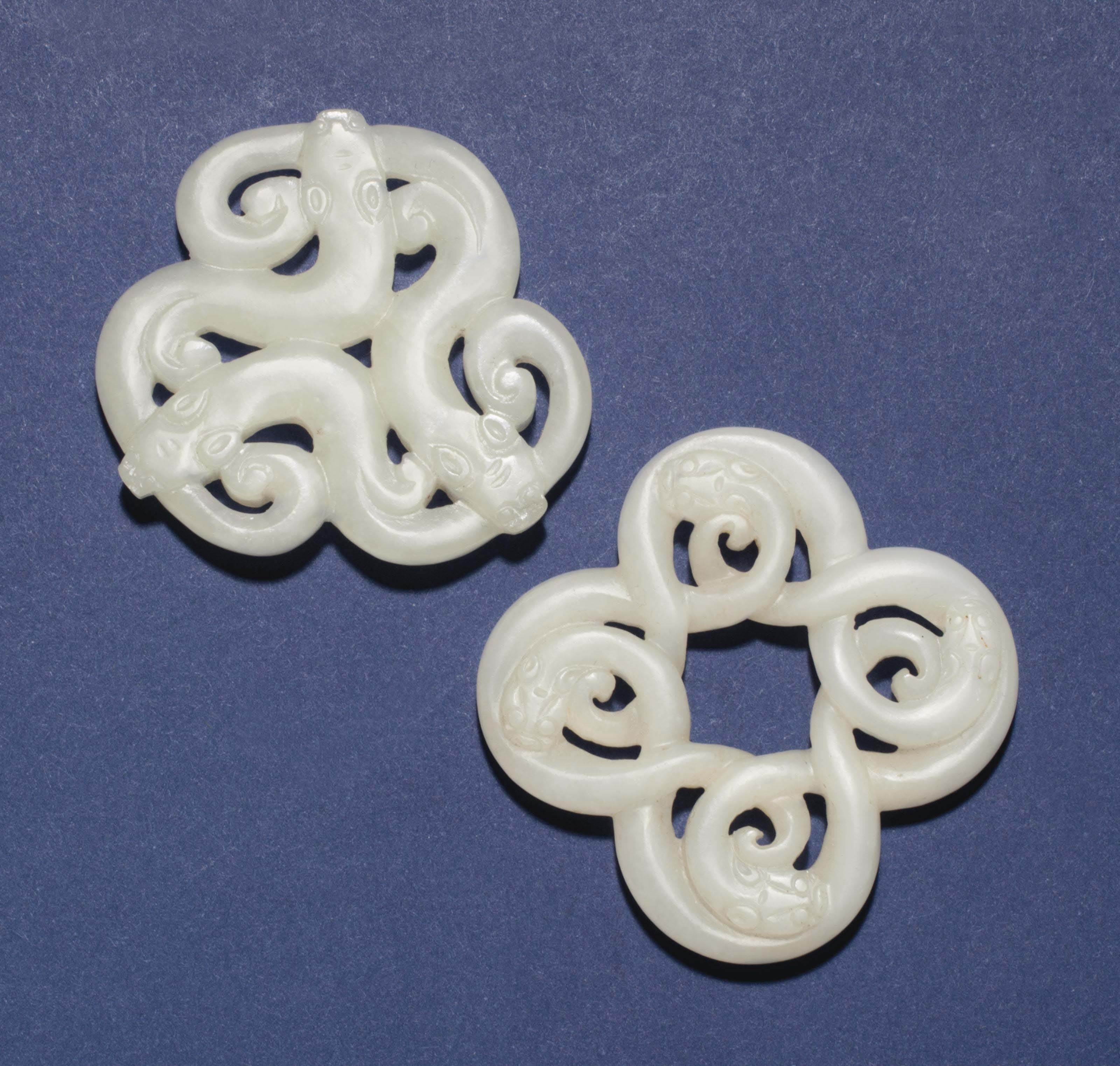 TWO WHITE JADE OPENWORK 'CHILONG' PENDANTS , 18TH/19TH