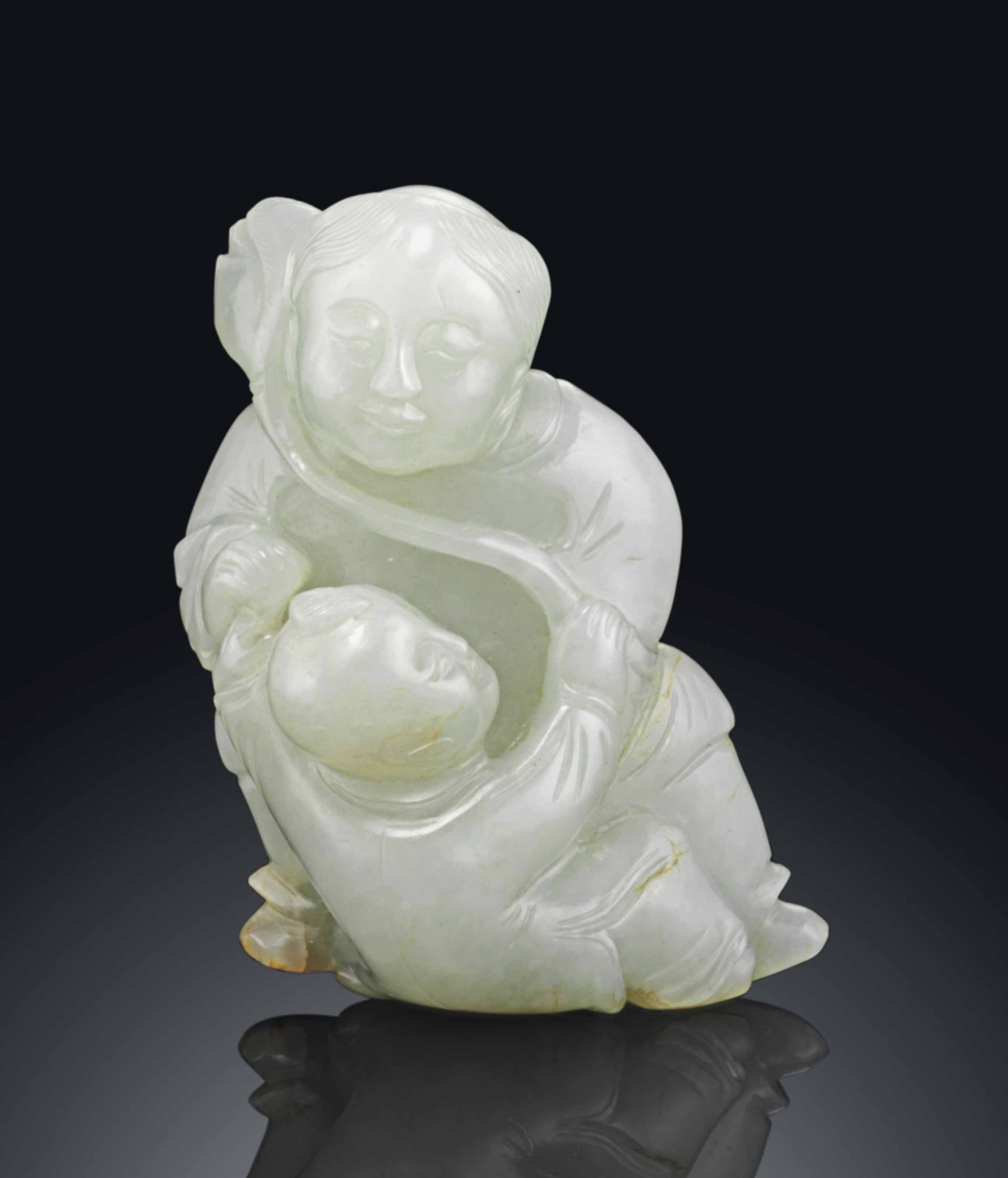 A WHITE JADE CARVING OF AN IMMORTAL AND BOY