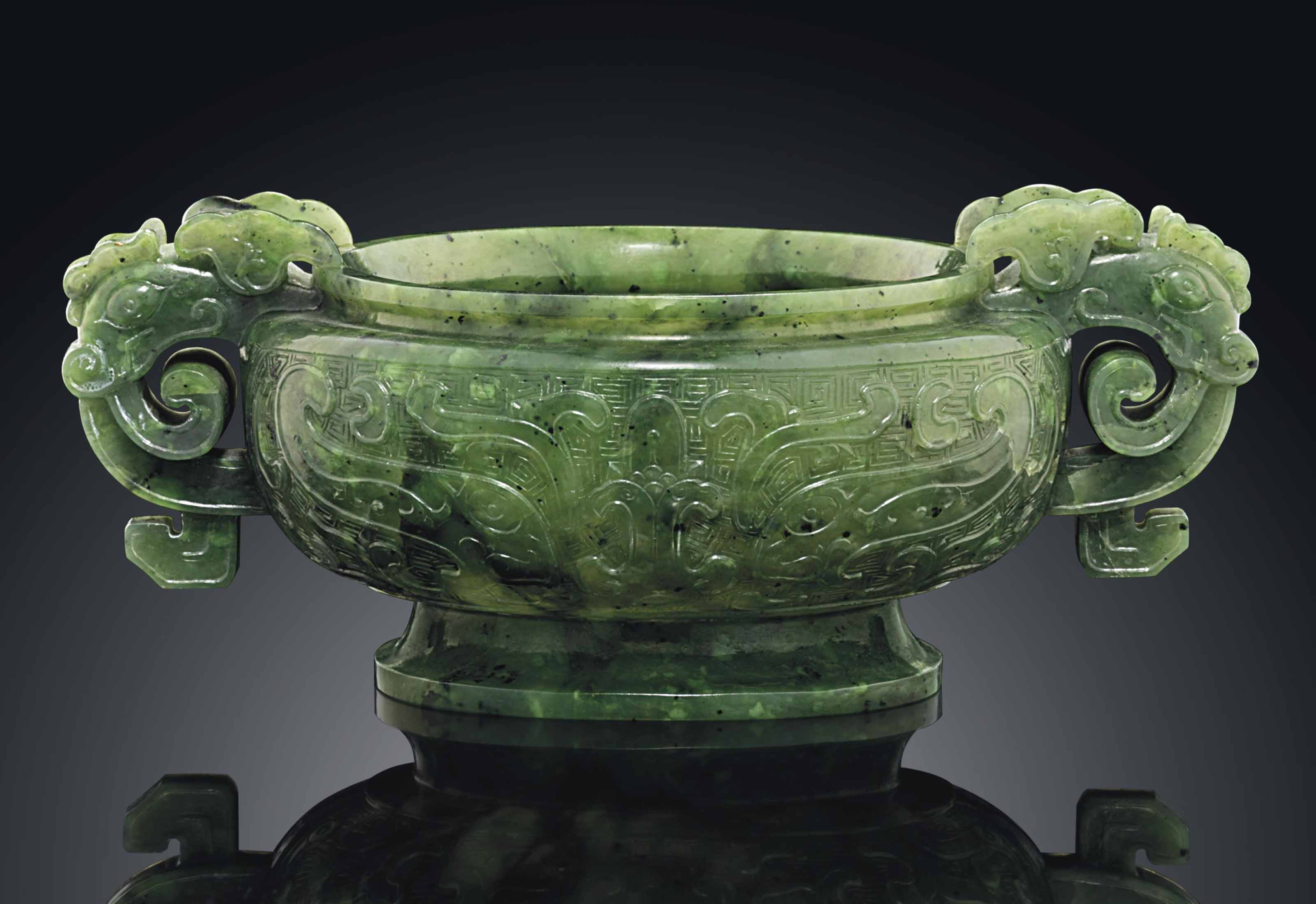 A FINELY CARVED ARCHAISTIC SPINACHGREEN JADE CENSER , 18TH/19TH