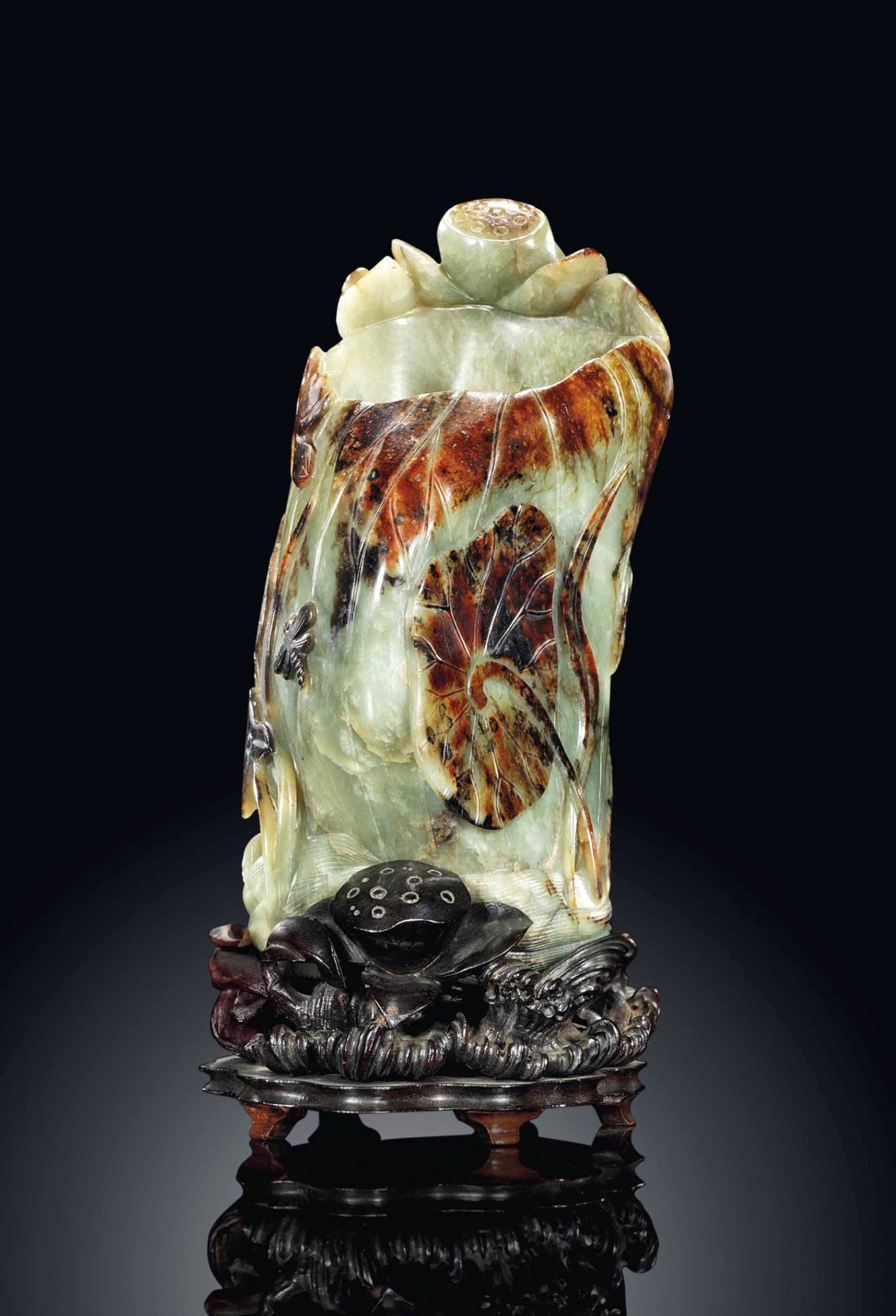 A CELADON AND RUSSET JADE 'LOTUS' VASE