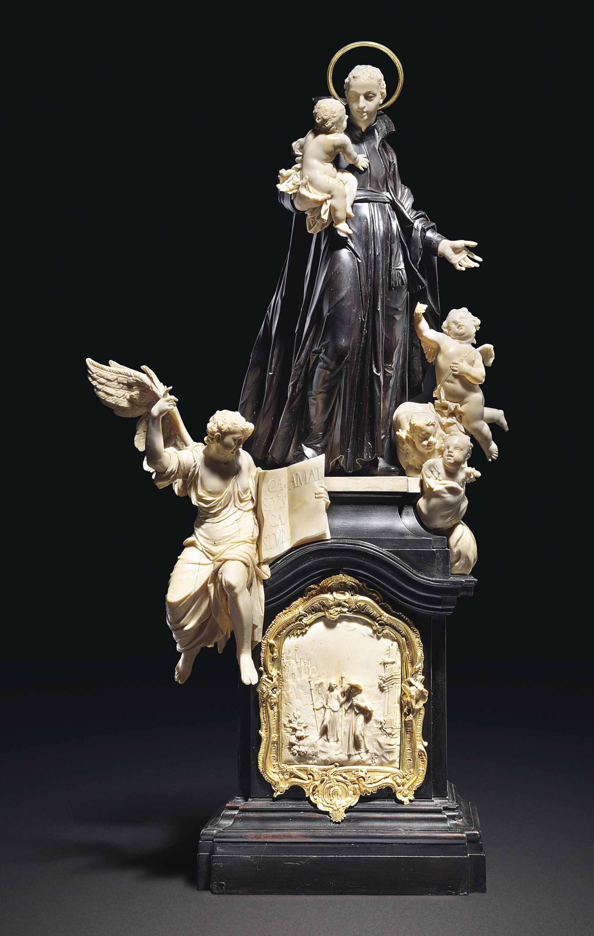 A CARVED EBONISED, EBONY AND IVORY GROUP OF SAINT STANISLAS KOSTKA