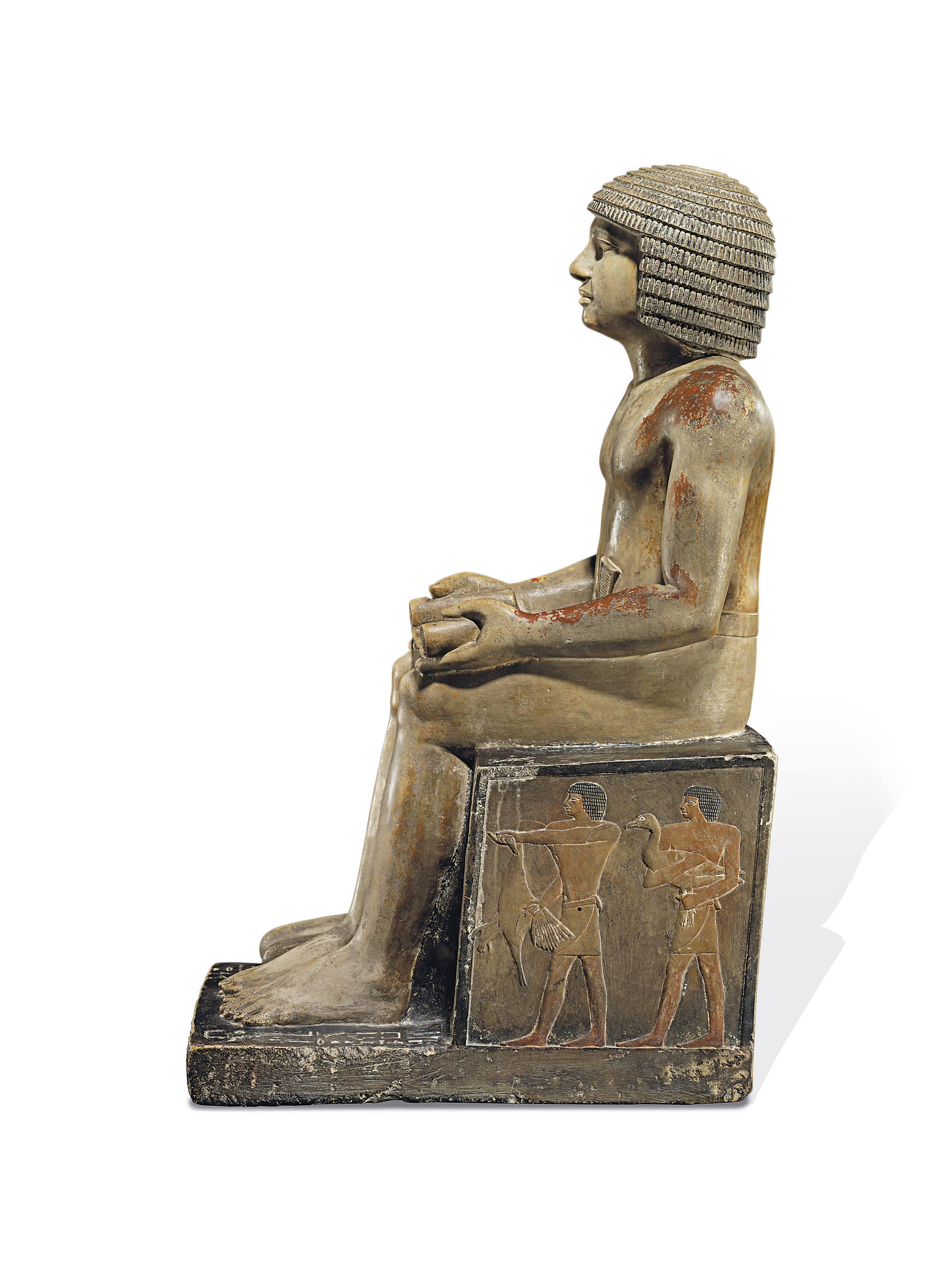 AN EXCEPTIONAL EGYPTIAN PAINTED LIMESTONE STATUE FOR THE INSPECTOR OF