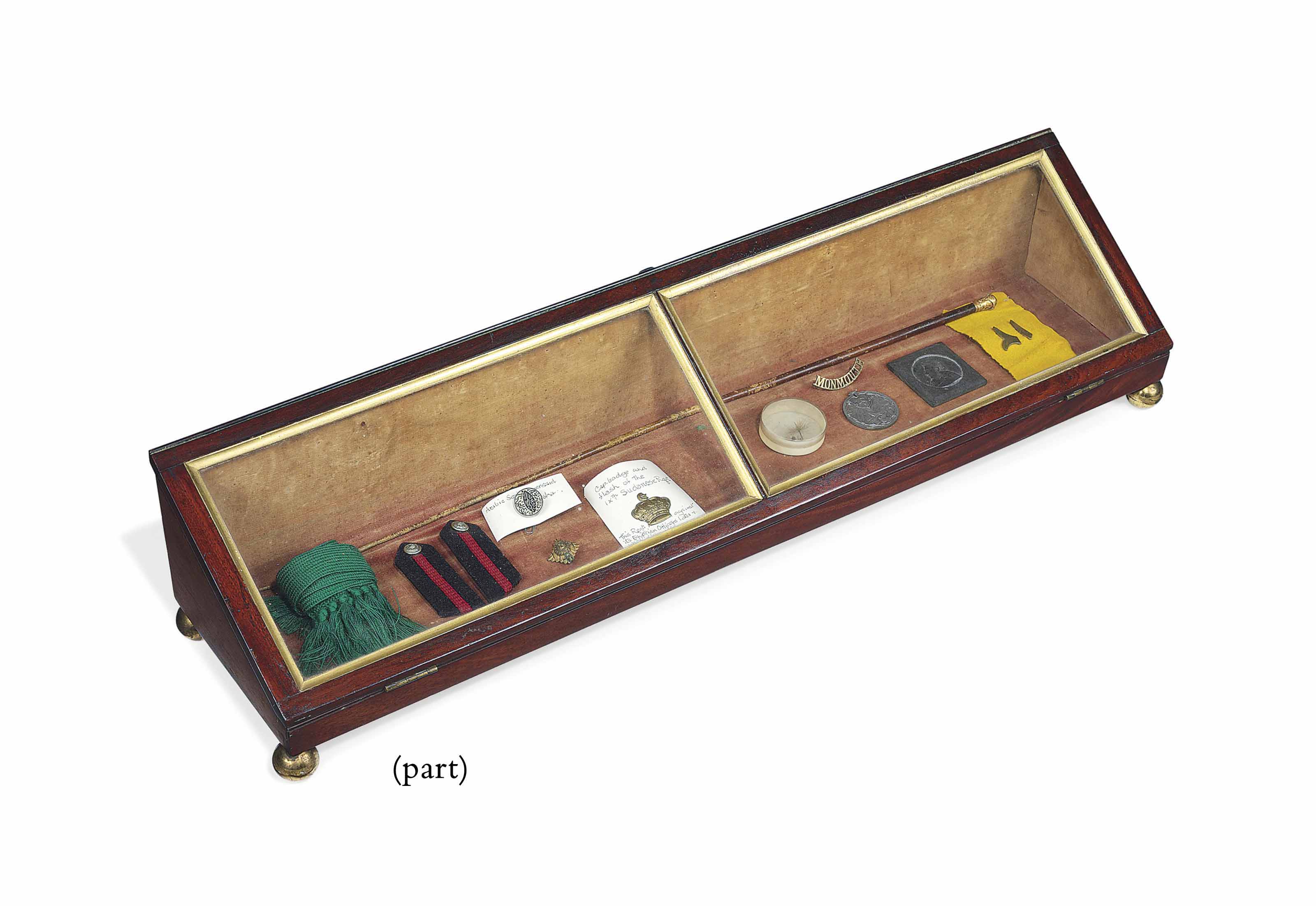 A VICTORIAN MAHOGANY GLAZED DISPLAY CONTAINING MILITARY