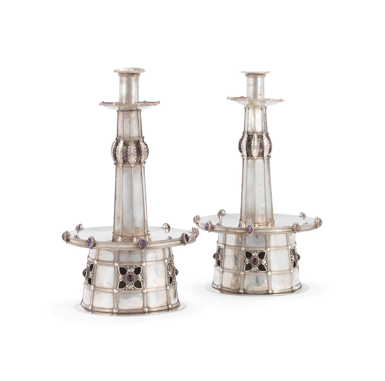 A PAIR OF ARTS AND CRAFTS HARDSTONEMOUNTED SILVER ALTAR CANDLESTICKS