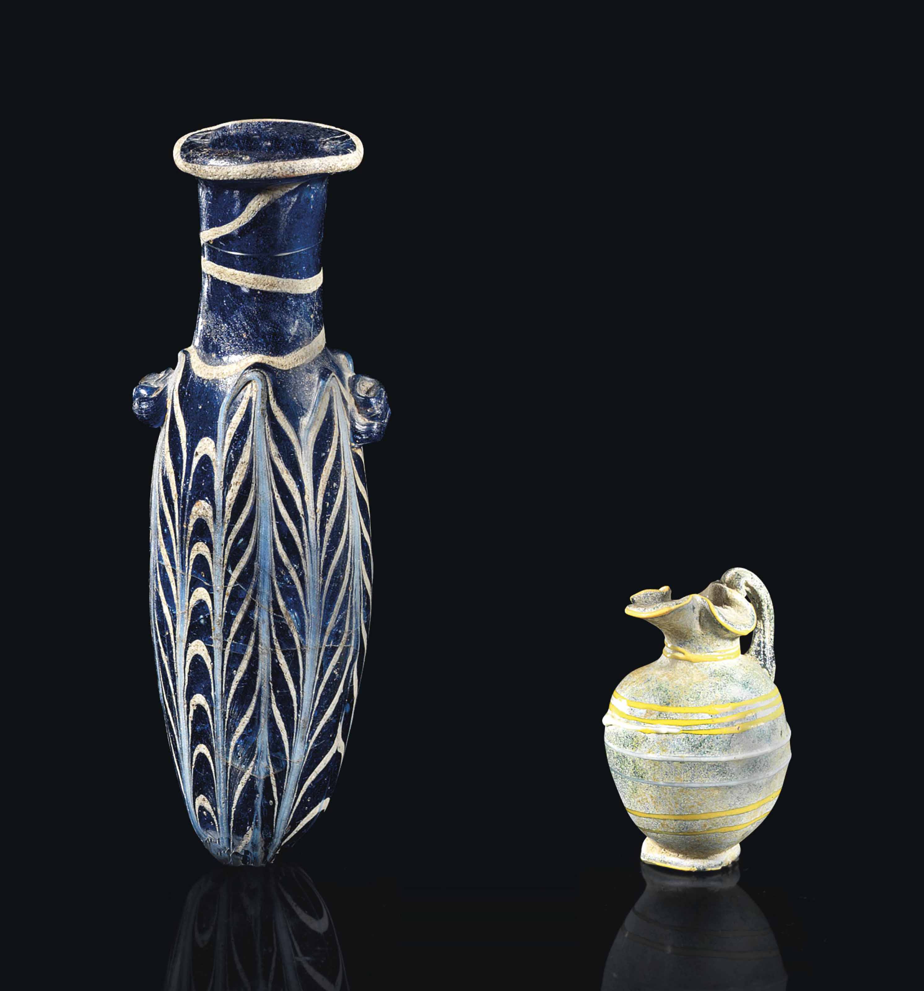 A GREEK COREFORMED GLASS ALABASTRON AND A MINIATURE GREEK GLASS