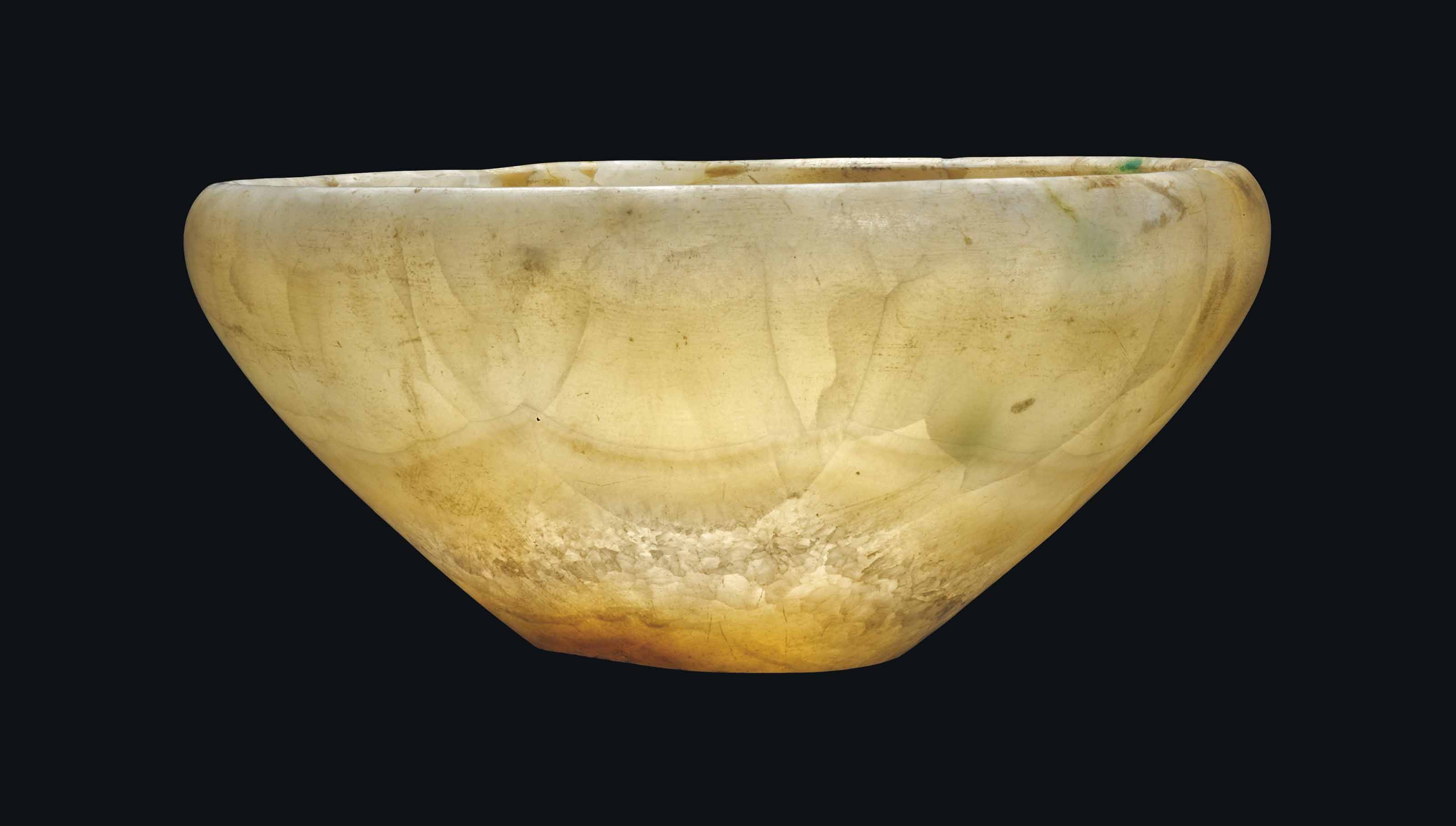 AN EGYPTIAN ALABASTER BOWL , EARLY DYNASTIC PERIOD, CIRCA 30002650 B.C