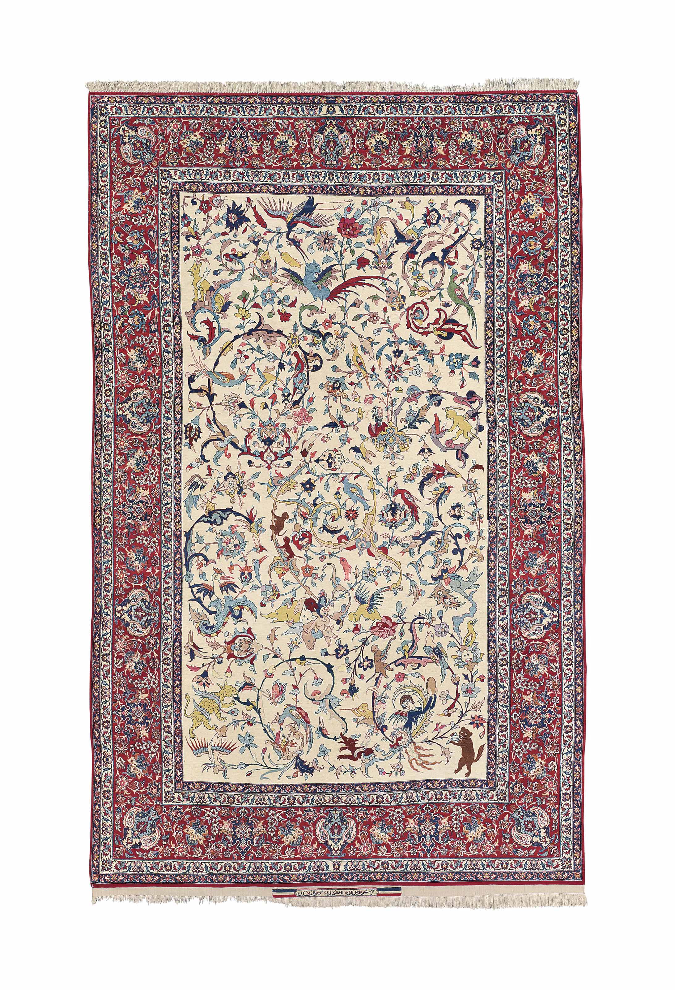 AN ISFAHAN SEIRAFIAN RUG , SIGNED MOHAMMAD 'ALI SEIRAFIAN, CENTRAL