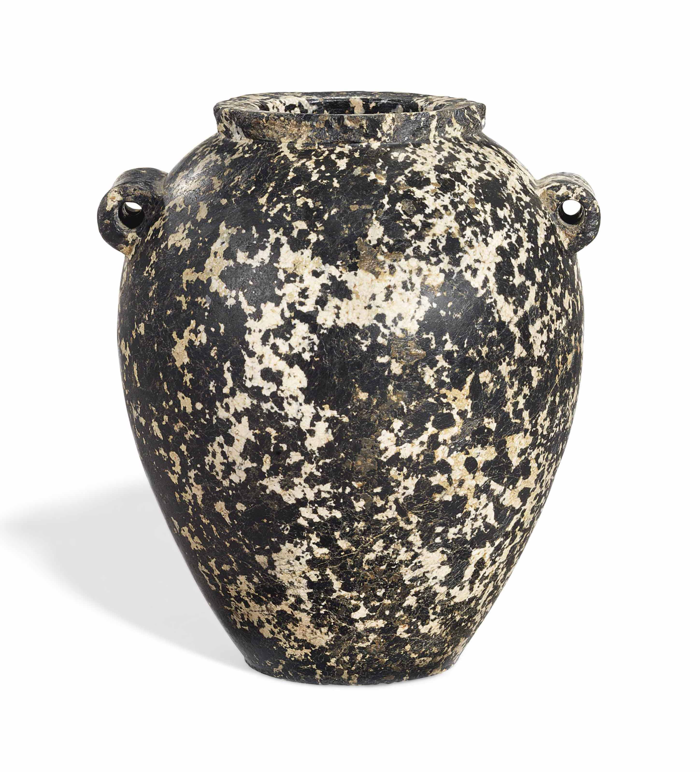 AN EGYPTIAN PEGMATITIC DIORITE JAR , PREDYNASTICEARLY DYNASTIC PERIOD