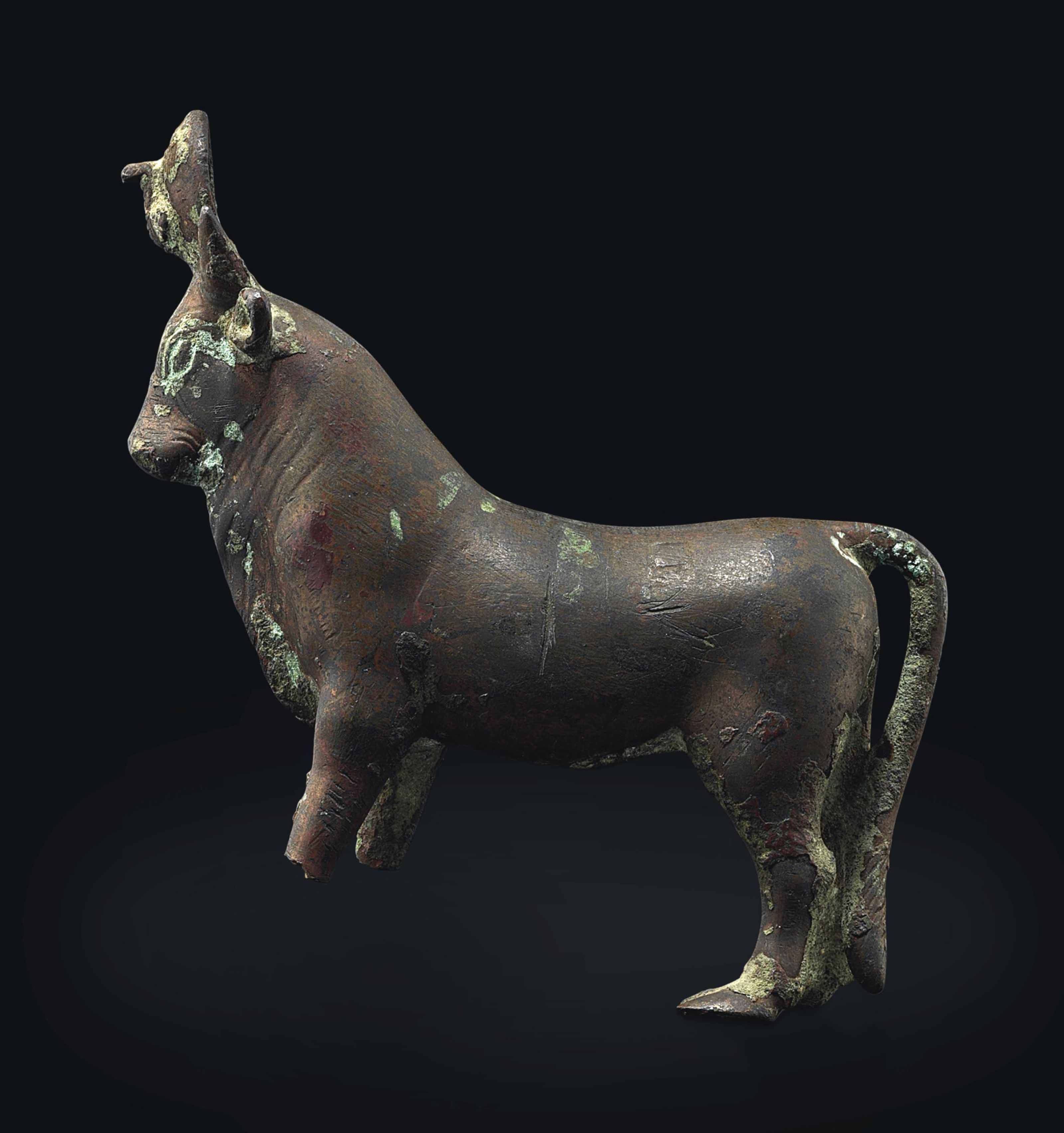AN EGYPTIAN BRONZE APIS BULL