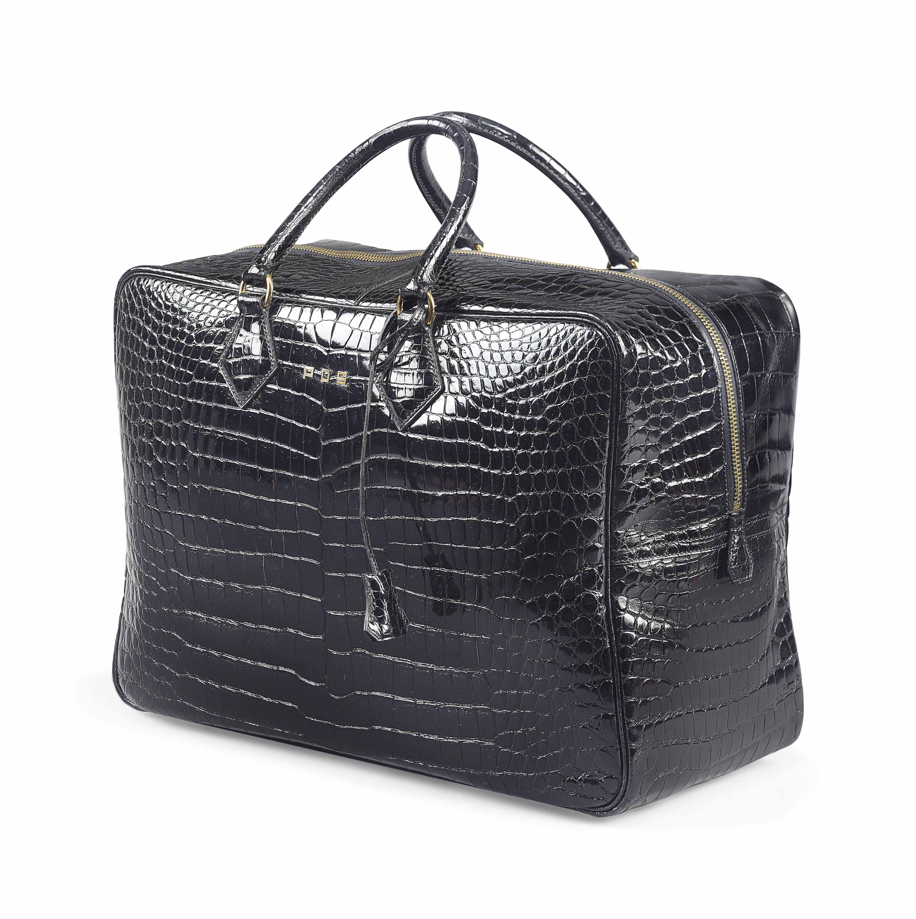 A BLACK CROCODILE SUITCASE, HERMÈS, 1993 | Christie's