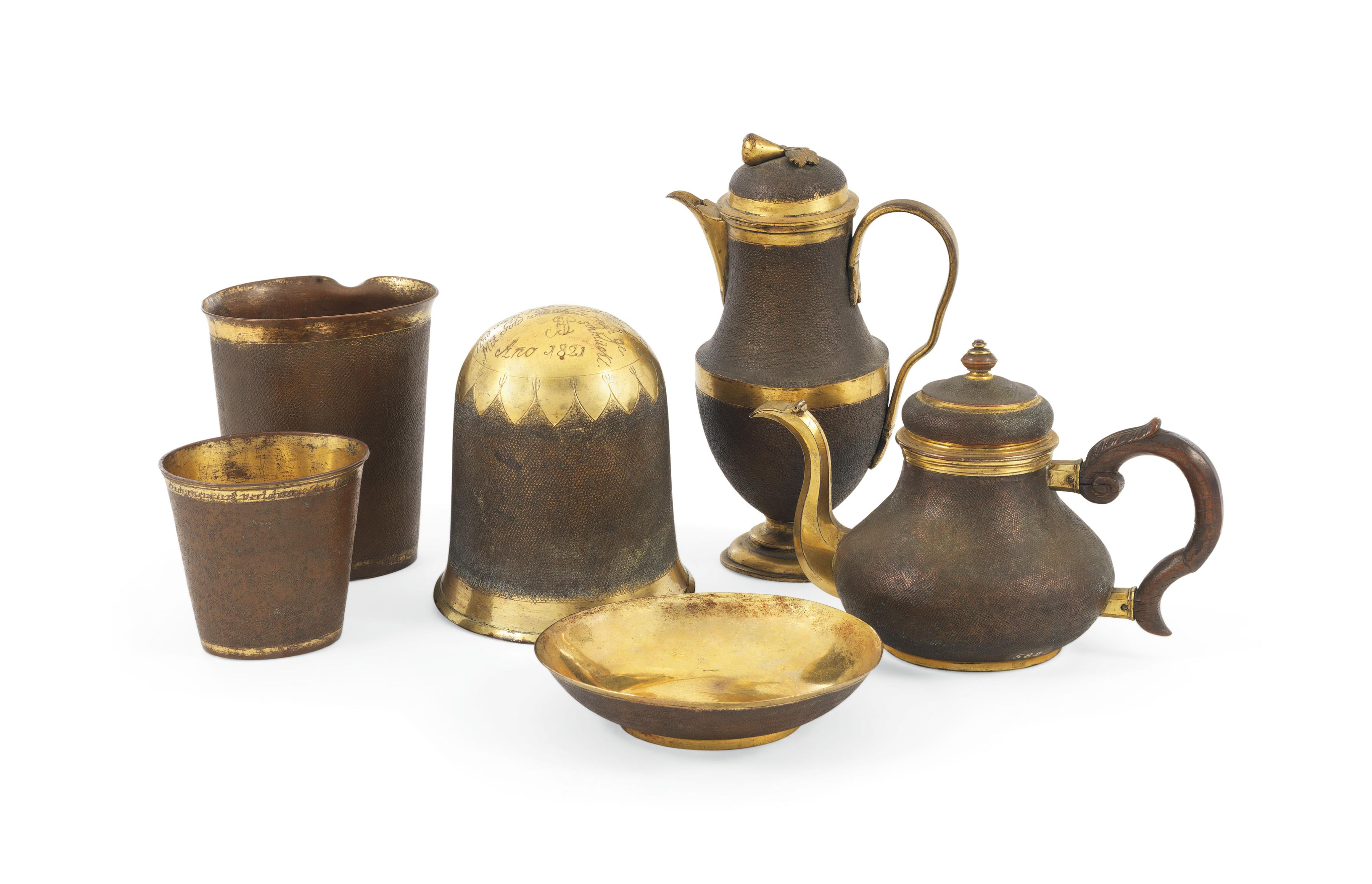 A HERRENGRUND PUNCHED AND PARCEL-GILT COPPER TEA-POT ...