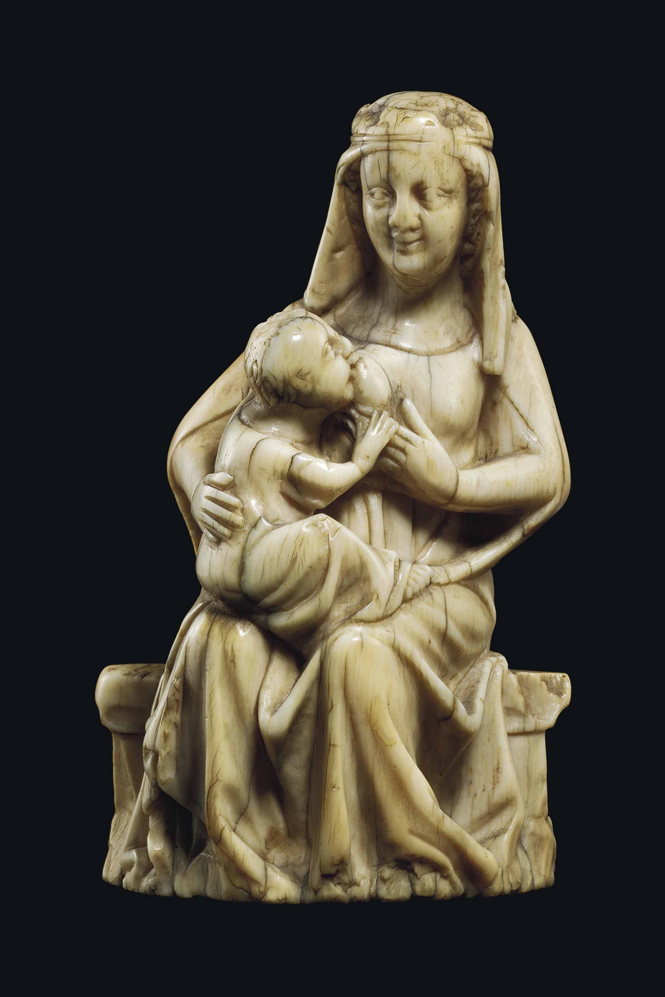 A CARVED IVORY GROUP OF THE VIRGIN AND CHILD ENTHRONED , ÎLEDEFRANCE