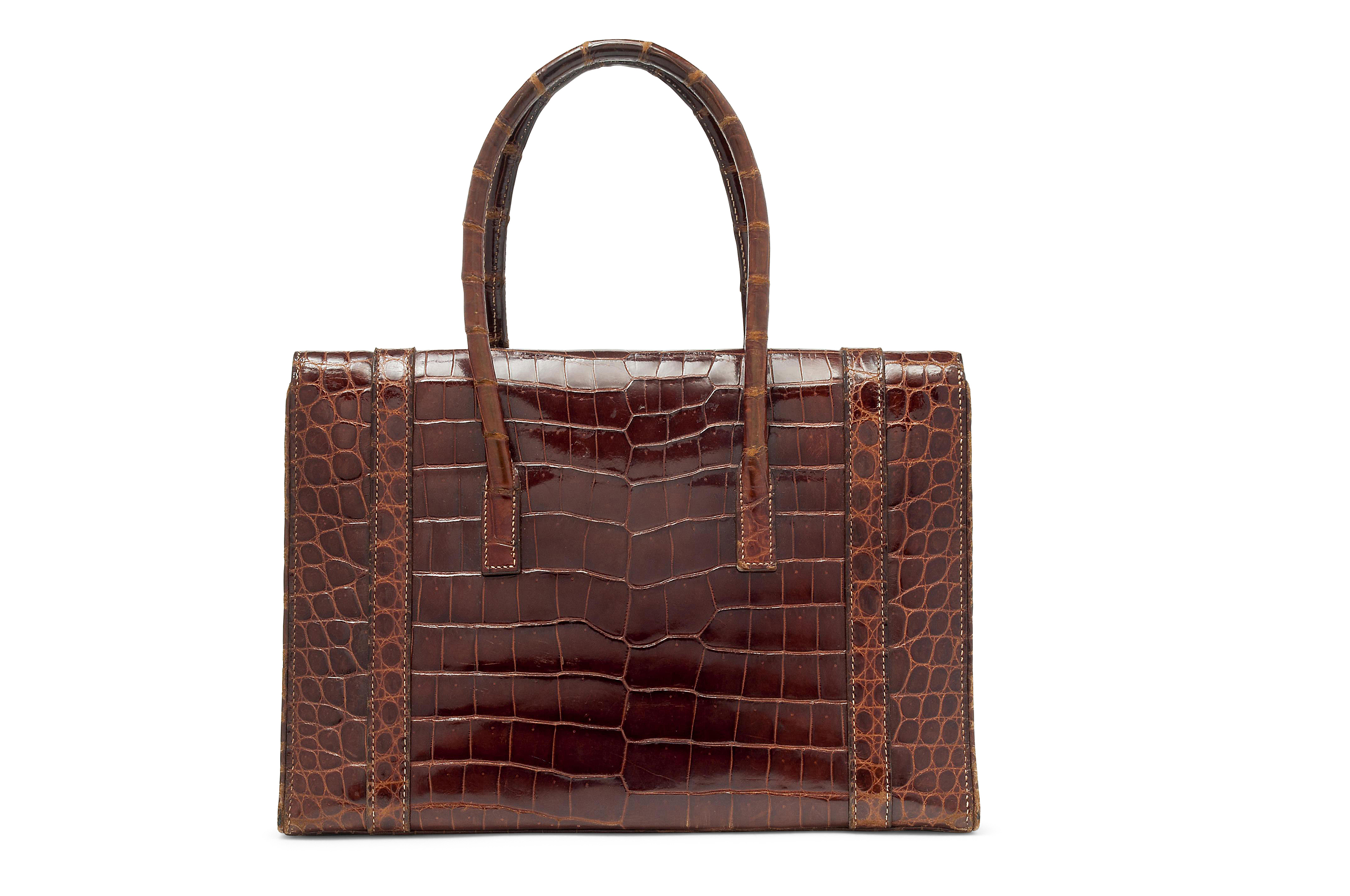 A SHINY MIEL CROCODILE DRAG 30 BAG, HERMÈS, CIRCA 1965 | Christie's