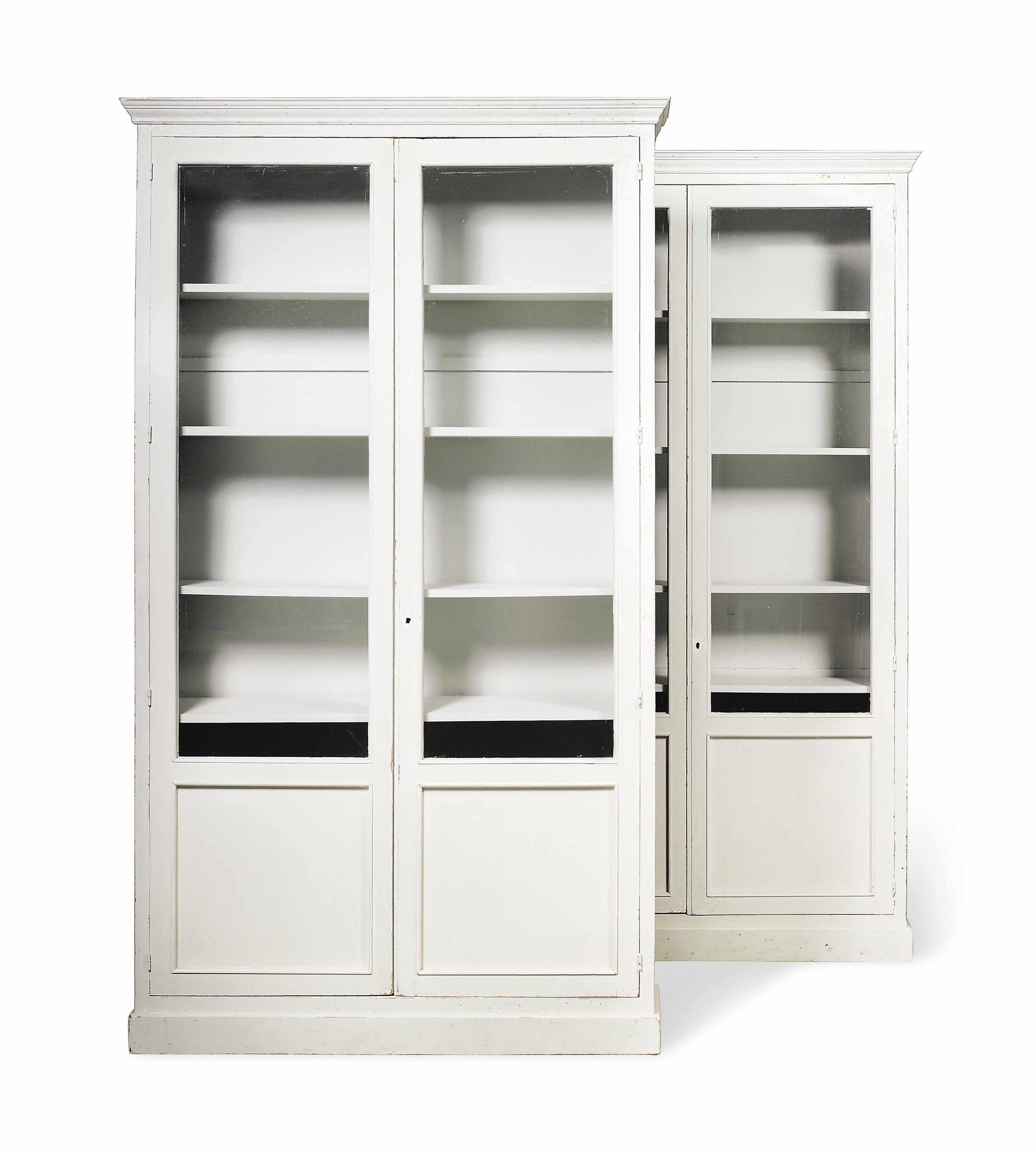 A PAIR OF WHITEPAINTED BOOKCASES , MID20TH CENTURY Christie's