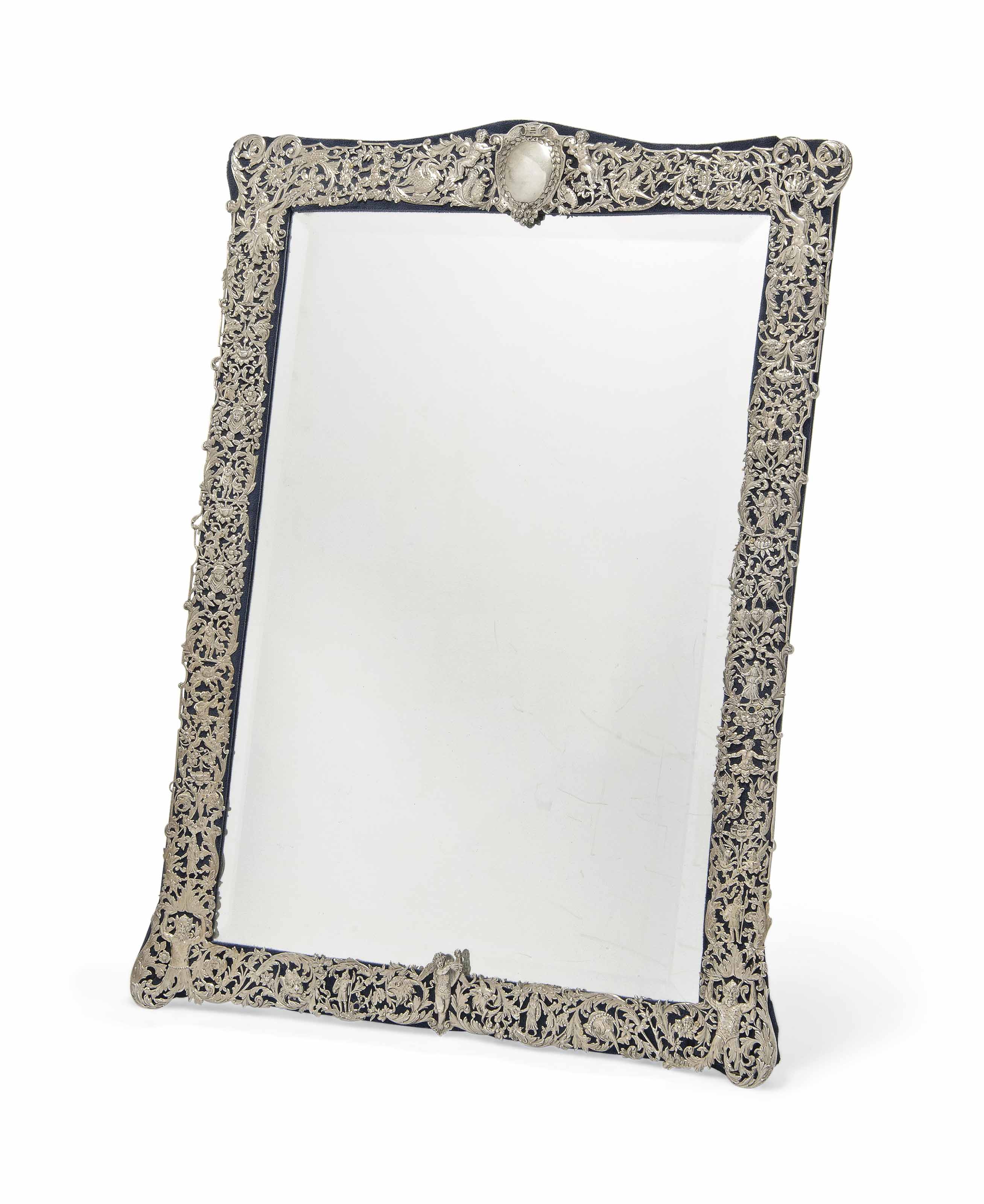 A LARGE VICTORIAN SILVER DRESSING TABLE MIRROR