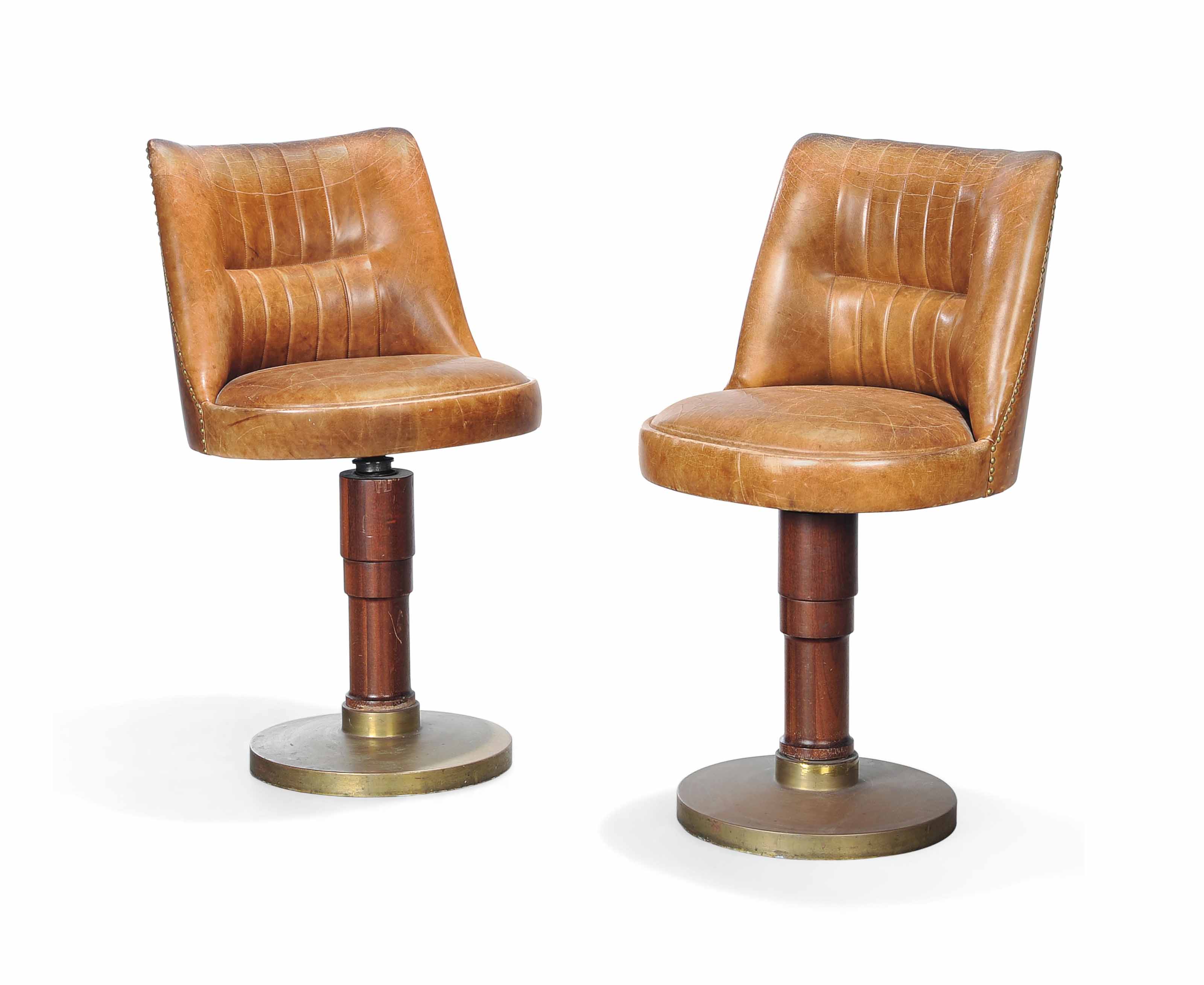 A PAIR OF ART DECO BROWN LEATHER BAR STOOLS