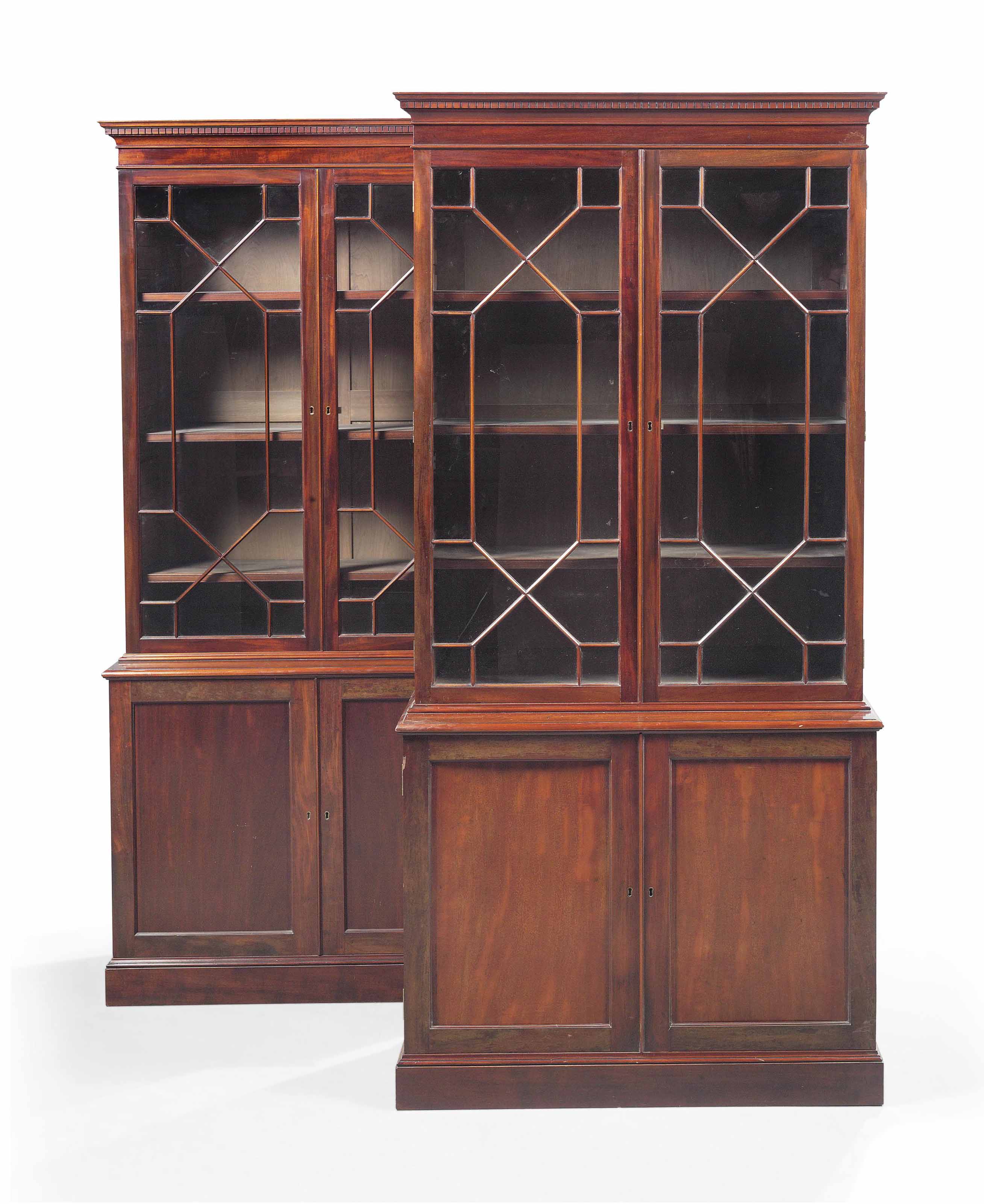A PAIR OF MAHOGANY BOOKCASES