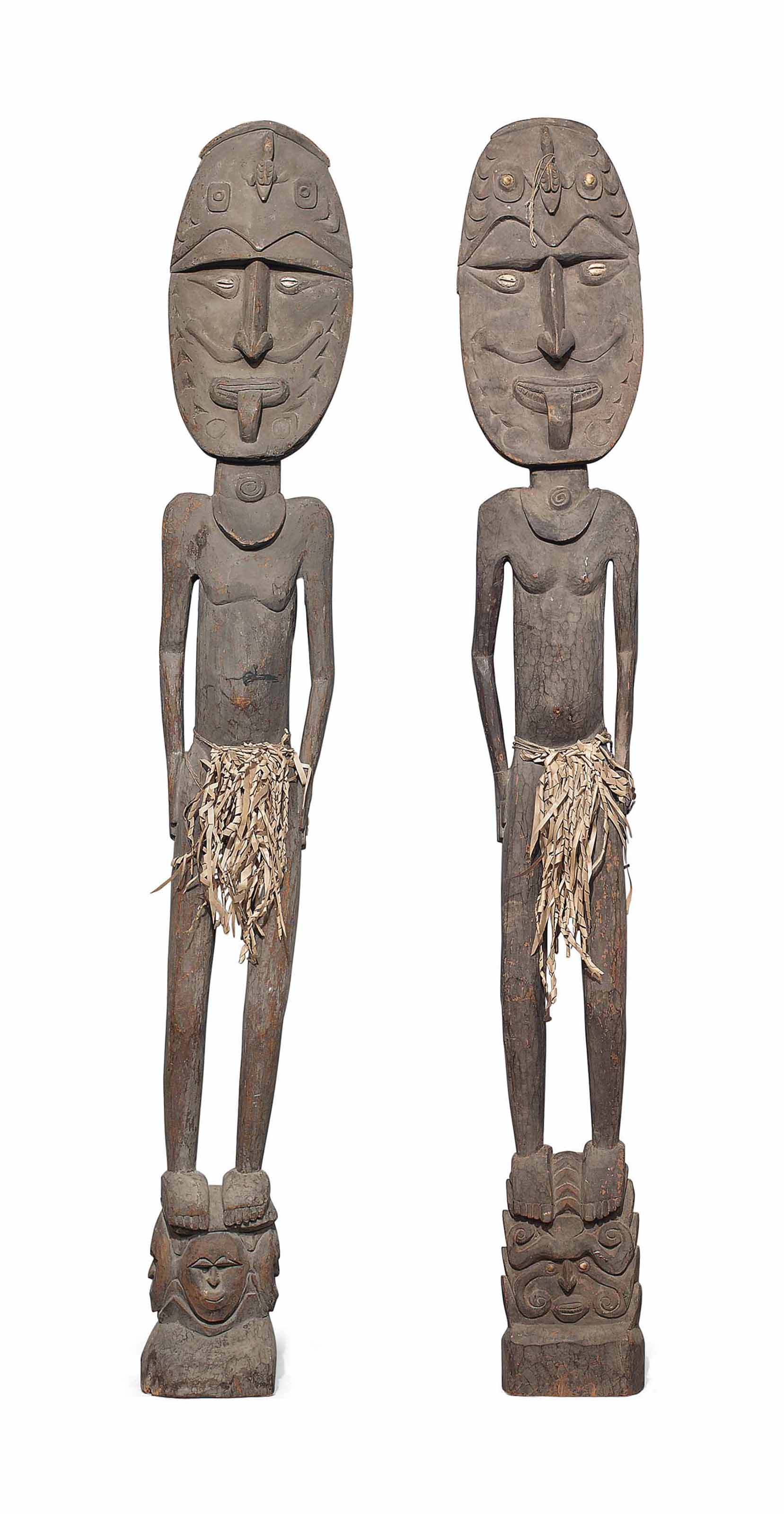 A PAIR OF CARVED WOOD TRIBAL FIGURES , PAPUA NEW GUINEA, 20TH CENTURY
