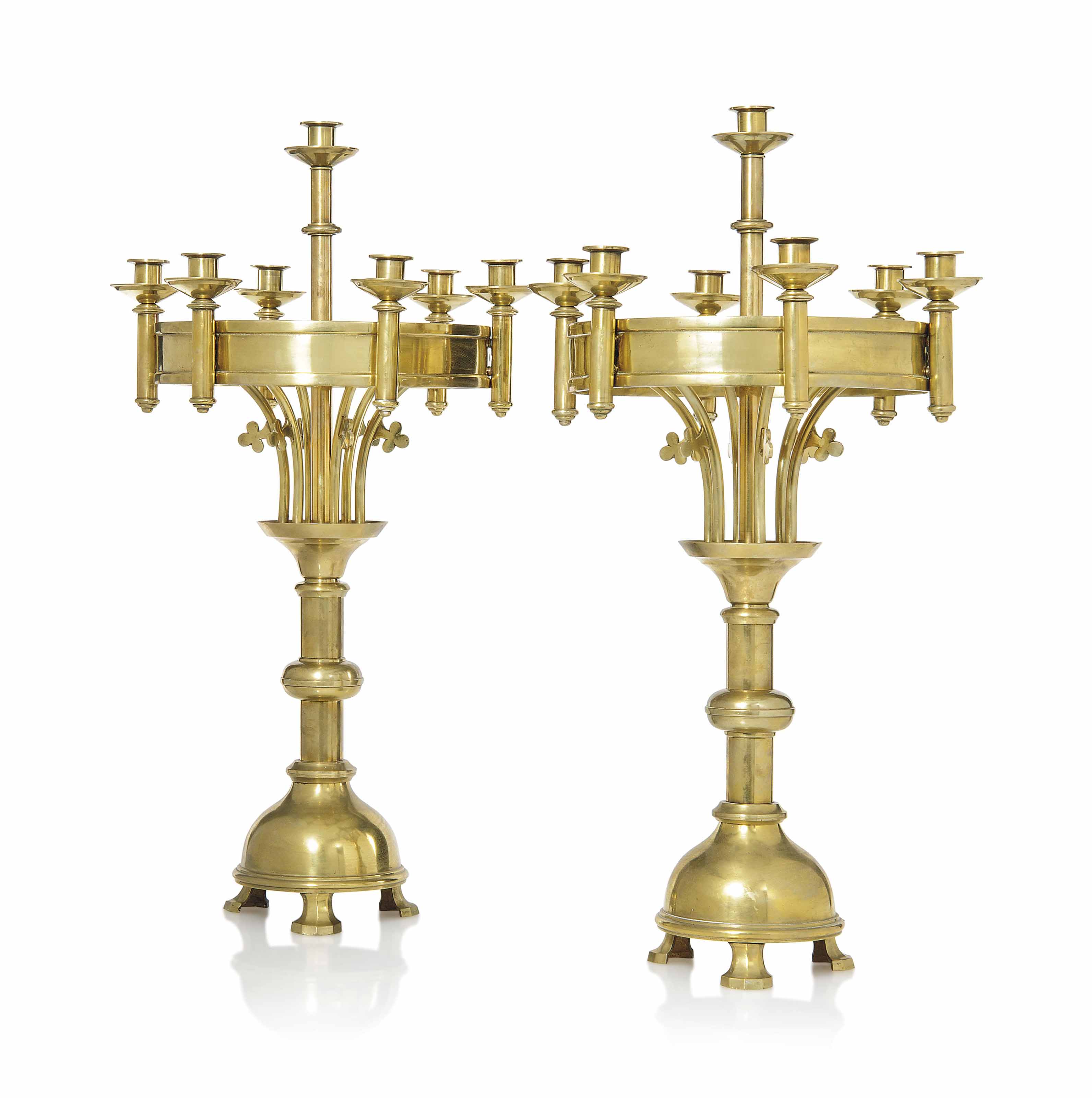 A LARGE PAIR OF GOTHIC REVIVAL BRASS CANDELABRA