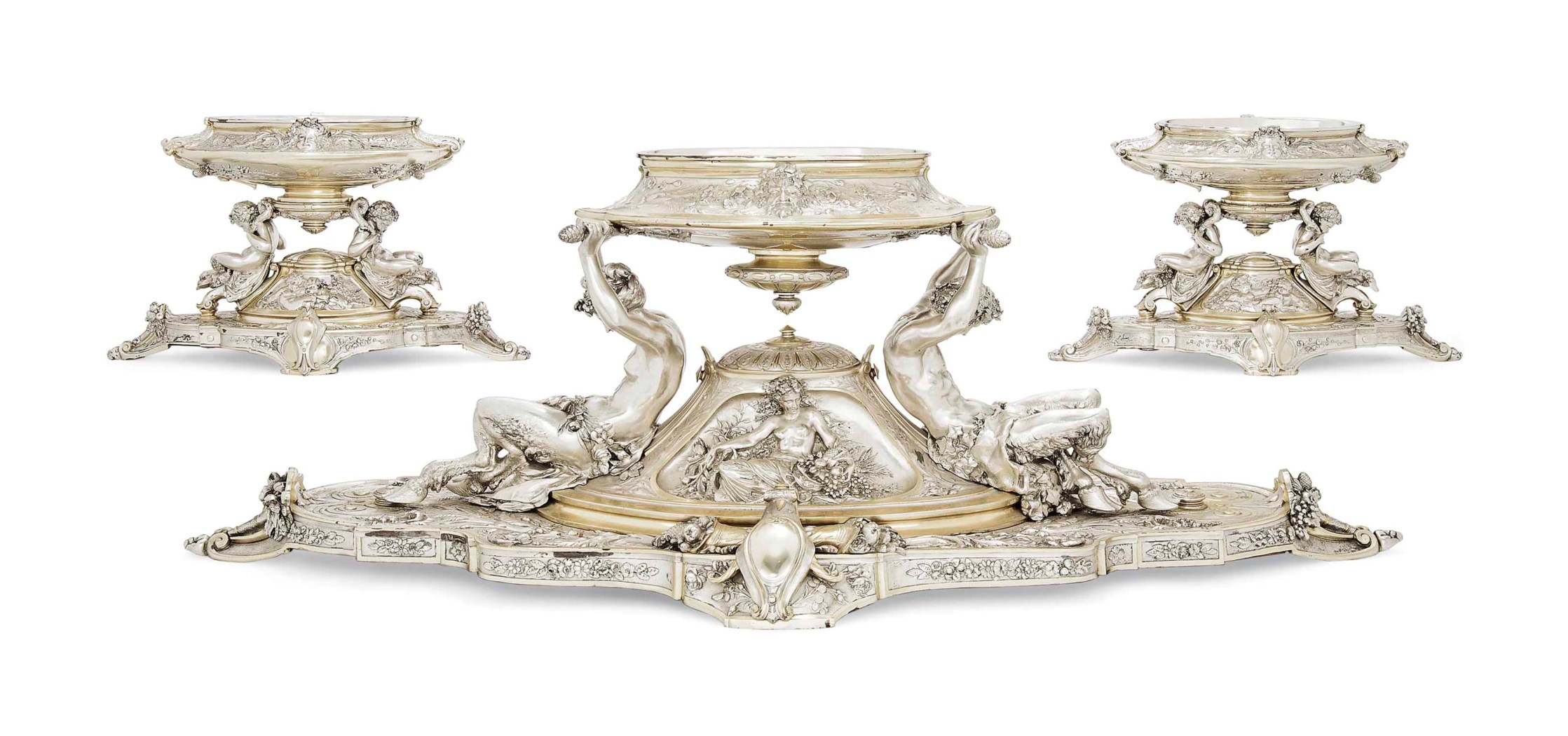 A VICTORIAN PARCELGILT SILVERPLATED THREEPIECE TABLE GARNITURE, MARK OF ELKINGTON & CO., 1881