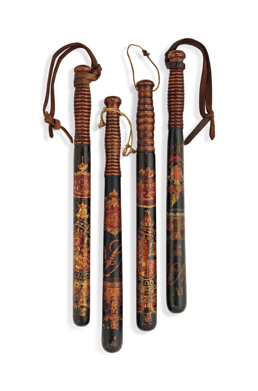 A GROUP OF FOUR POLYCHROME DECORATED WOOD TRUNCHEONS