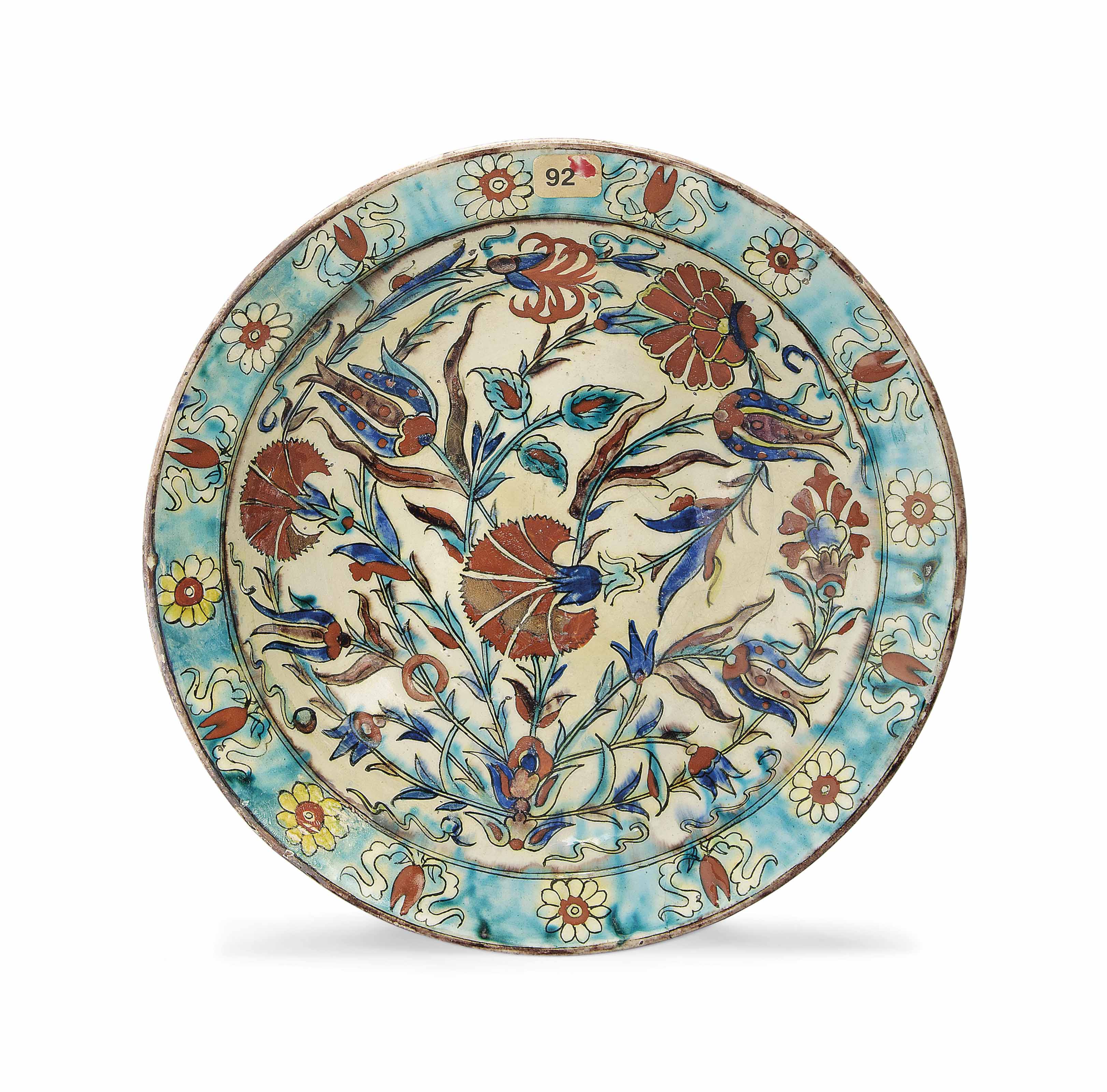 A KUTAHYA POTTERY DISH , OTTOMAN TURKEY, 19TH CENTURY Christie's