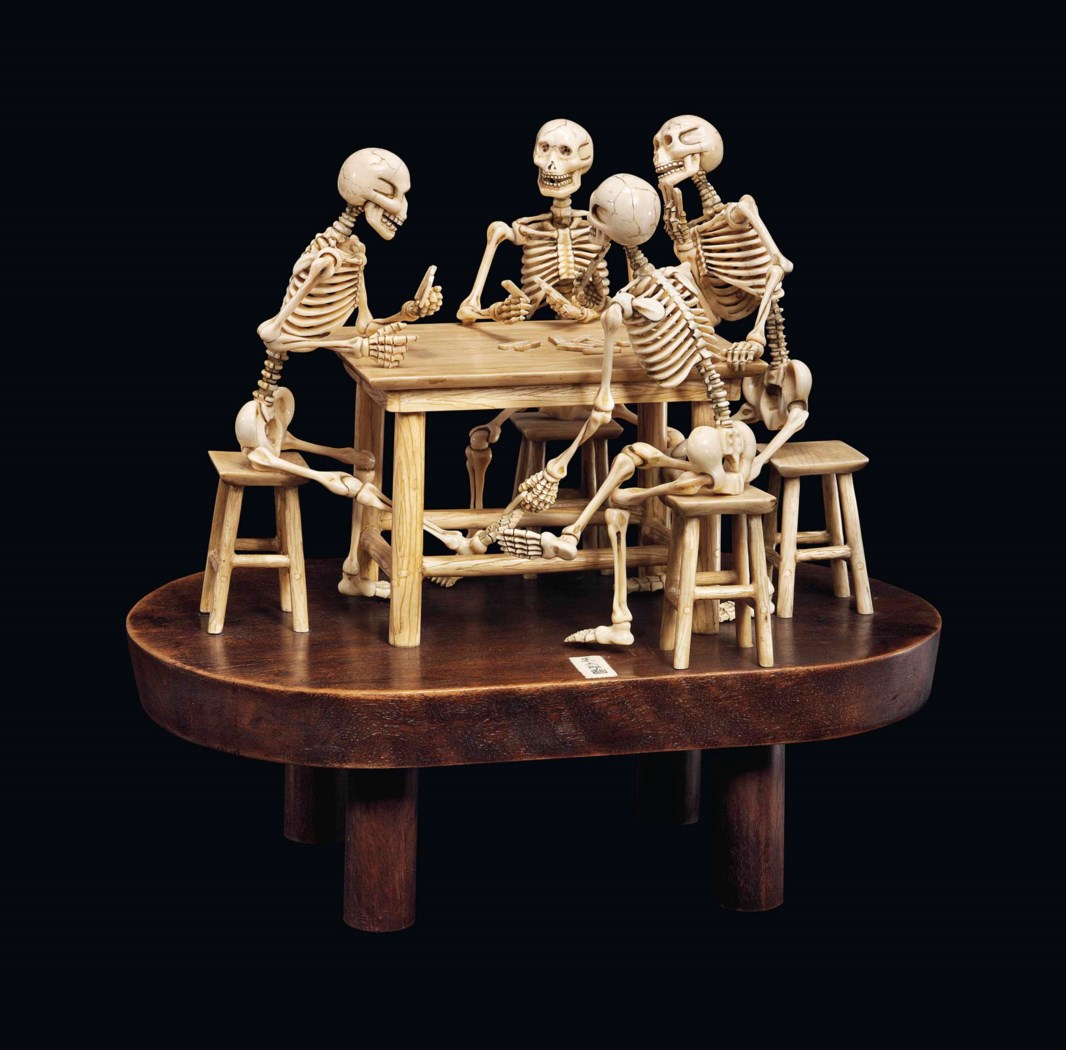 A Rare Ivory Okimono Of Four Skeletons Playing Dominoes
