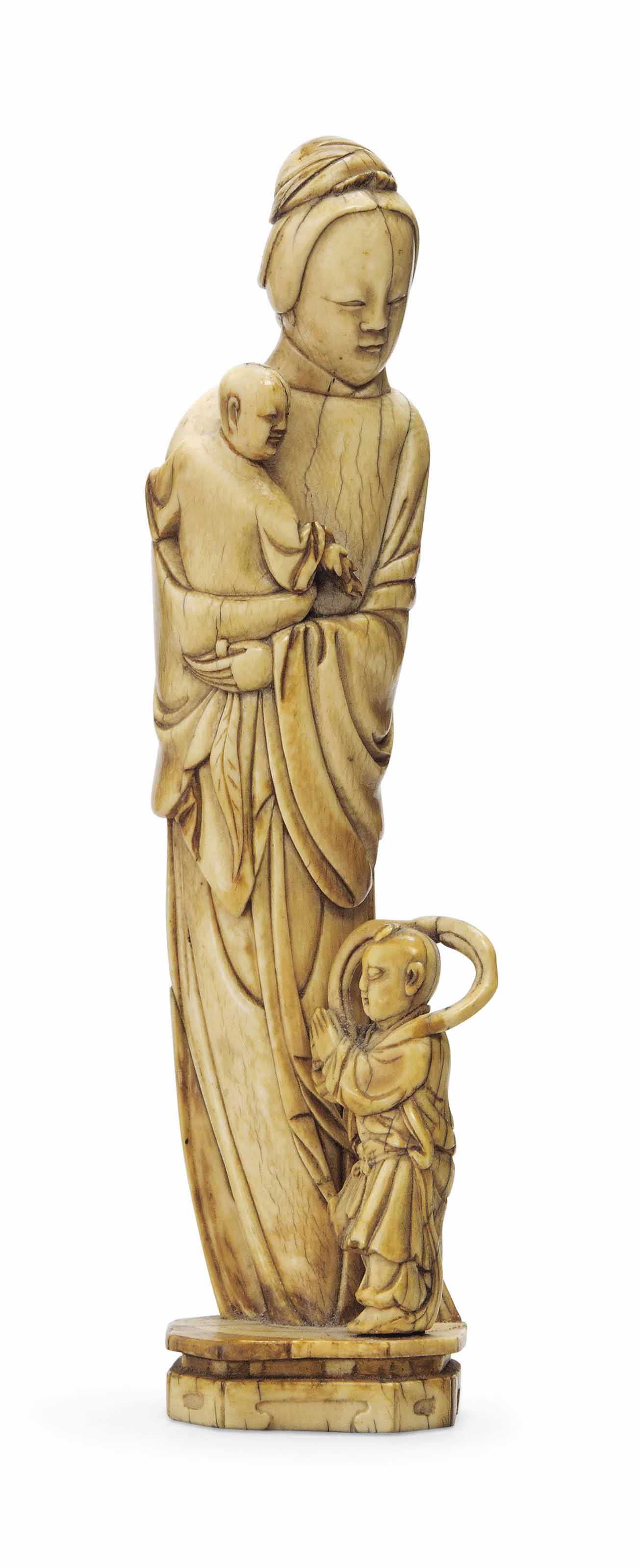 AN IVORY CARVING OF A LADY AND CHILDREN , MING DYNASTY, 17TH CENTURY