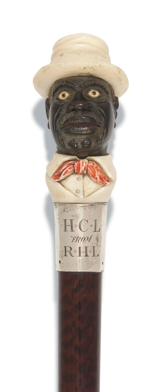 A LATE VICTORIAN IVORY AND HORN MOUNTED WALKING CANE