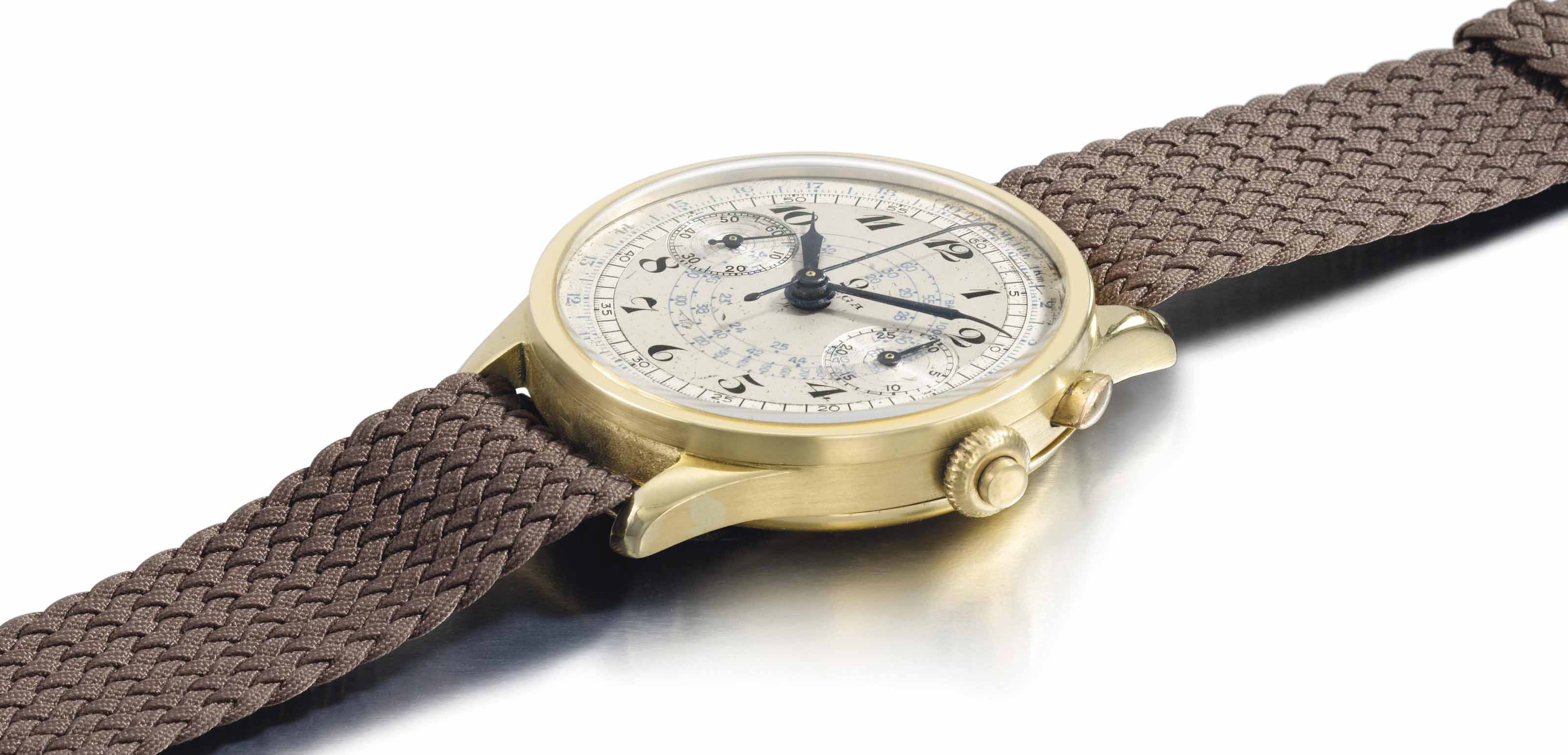 Omega. A rare and attractive 18k gold single button chronograph wristwatch  with two-tone silvered dial and Breguet numerals