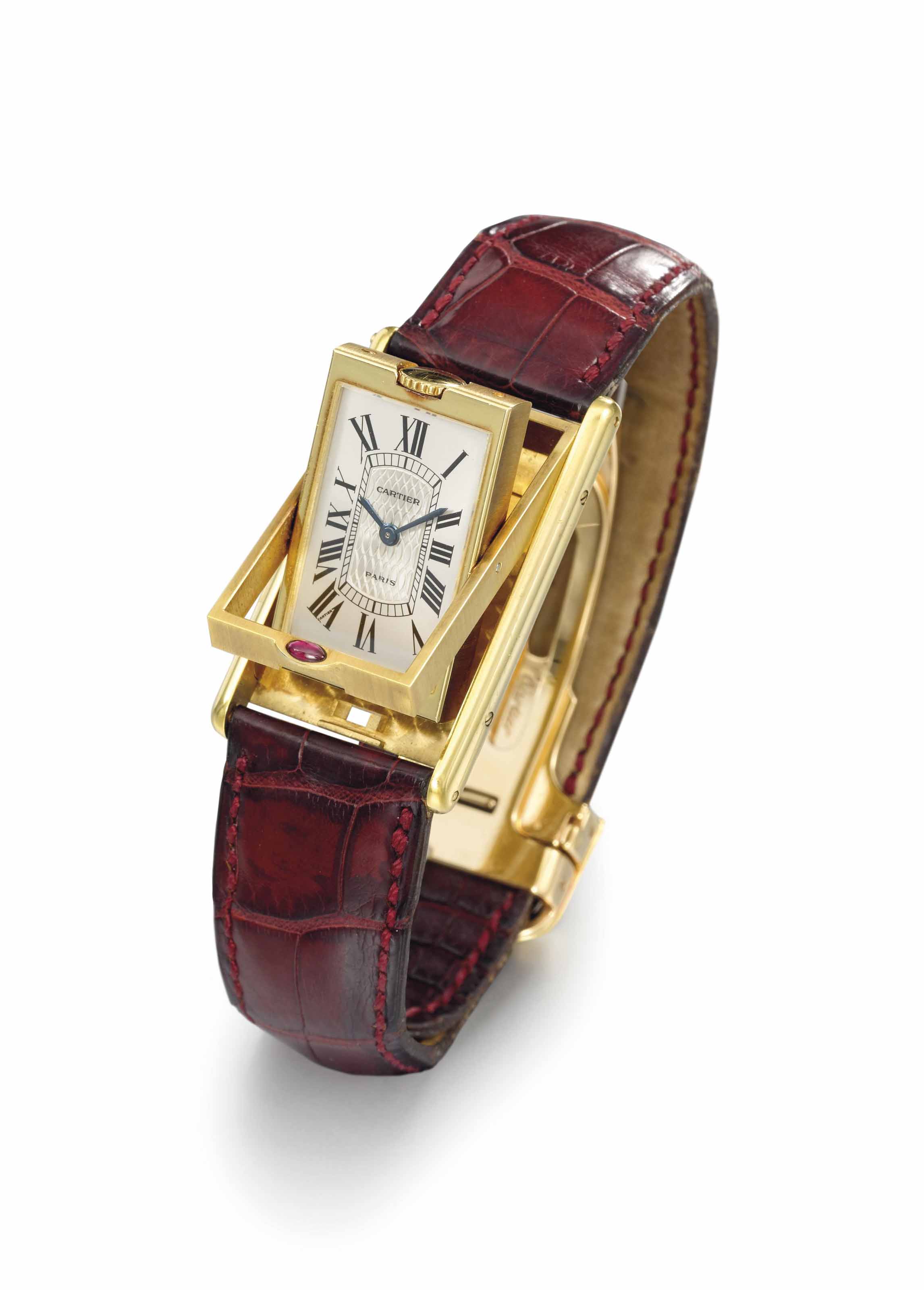 Cartier. An 18K gold limited edition rectangular reversible wristwatch