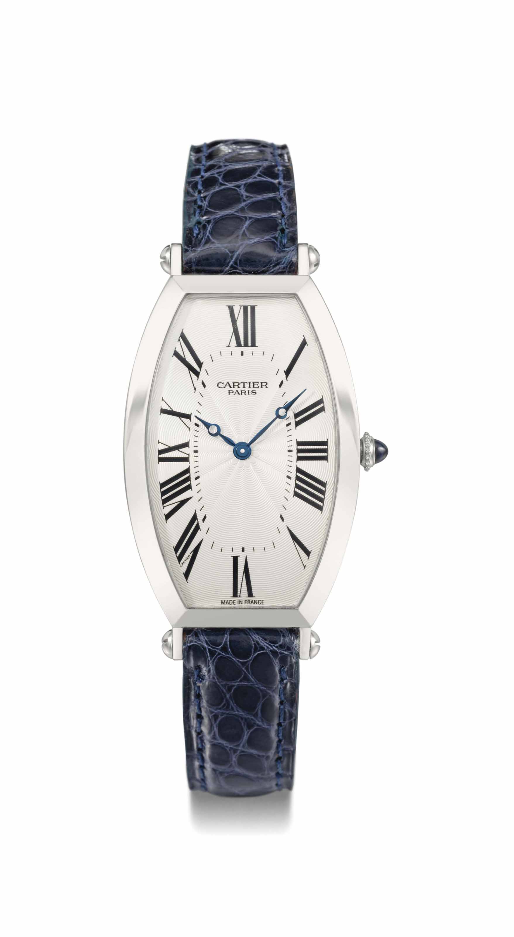 Cartier. A fine platinum tonneau-shaped 