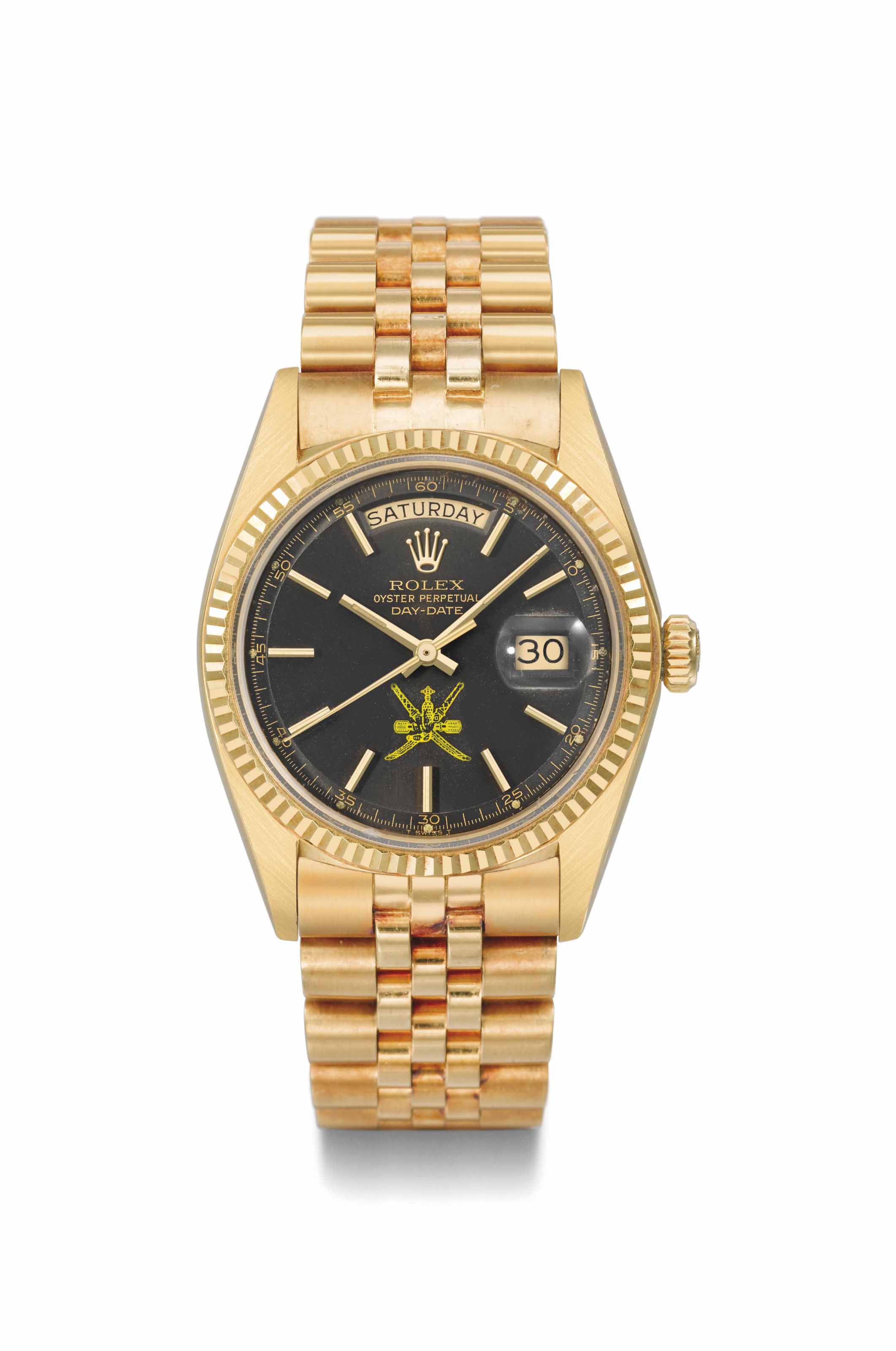 Rolex An unusual 18K gold automatic calendar wristwatch with brown