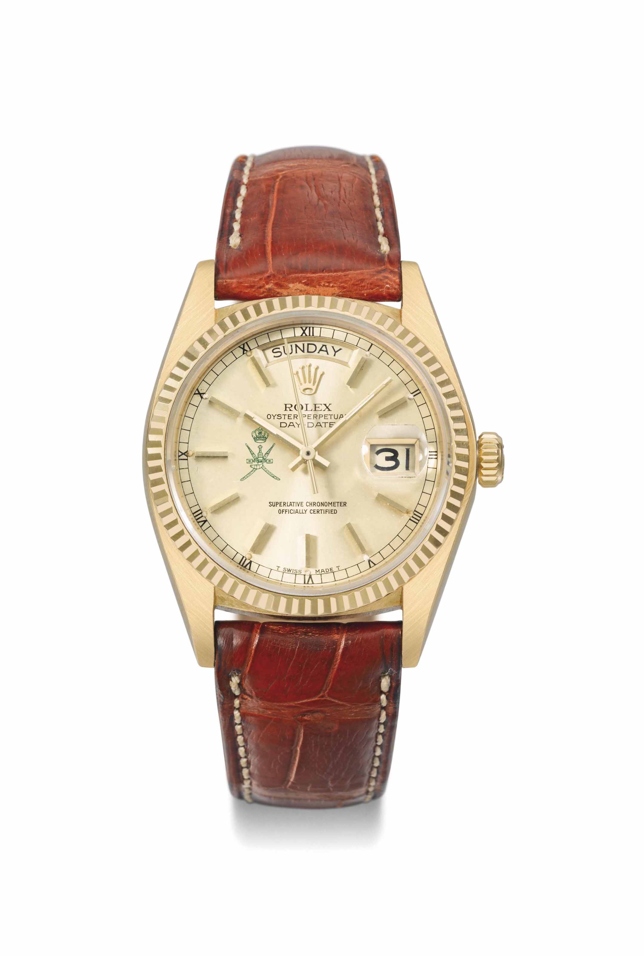 Rolex. A fine and very rare 18K gold automatic calendar wristwatch with