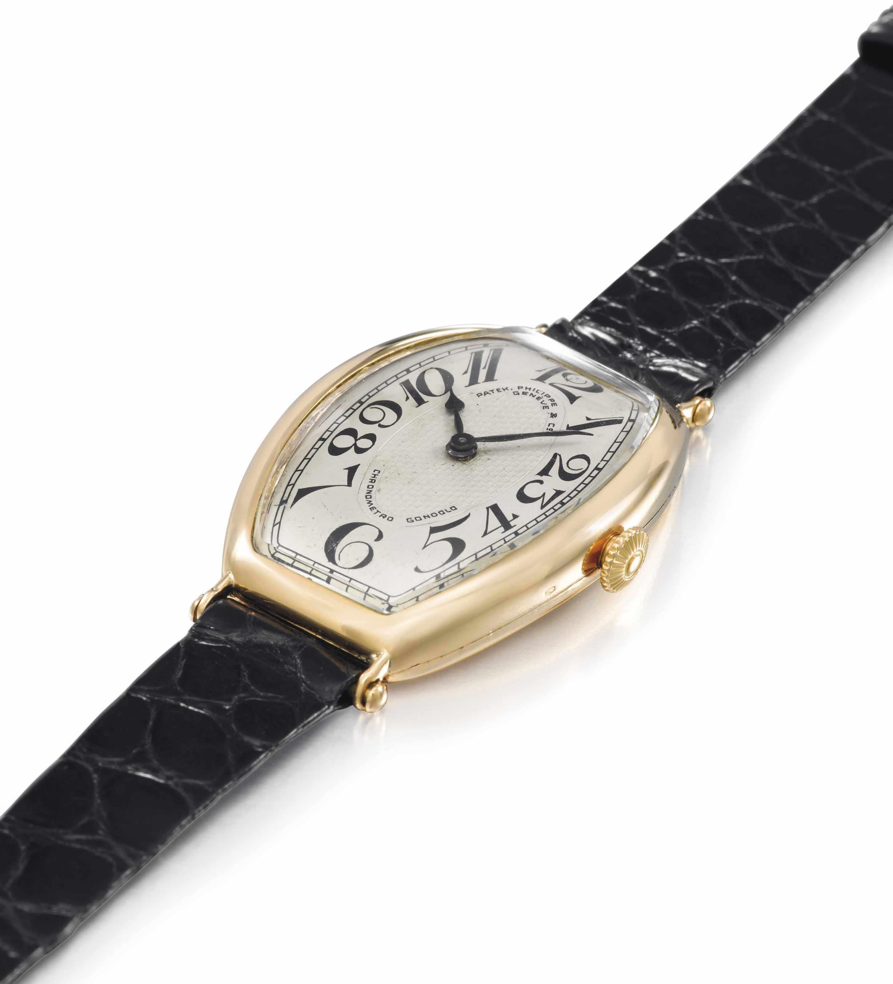 Patek Philippe. A very fine rare and large 18K gold tonneau