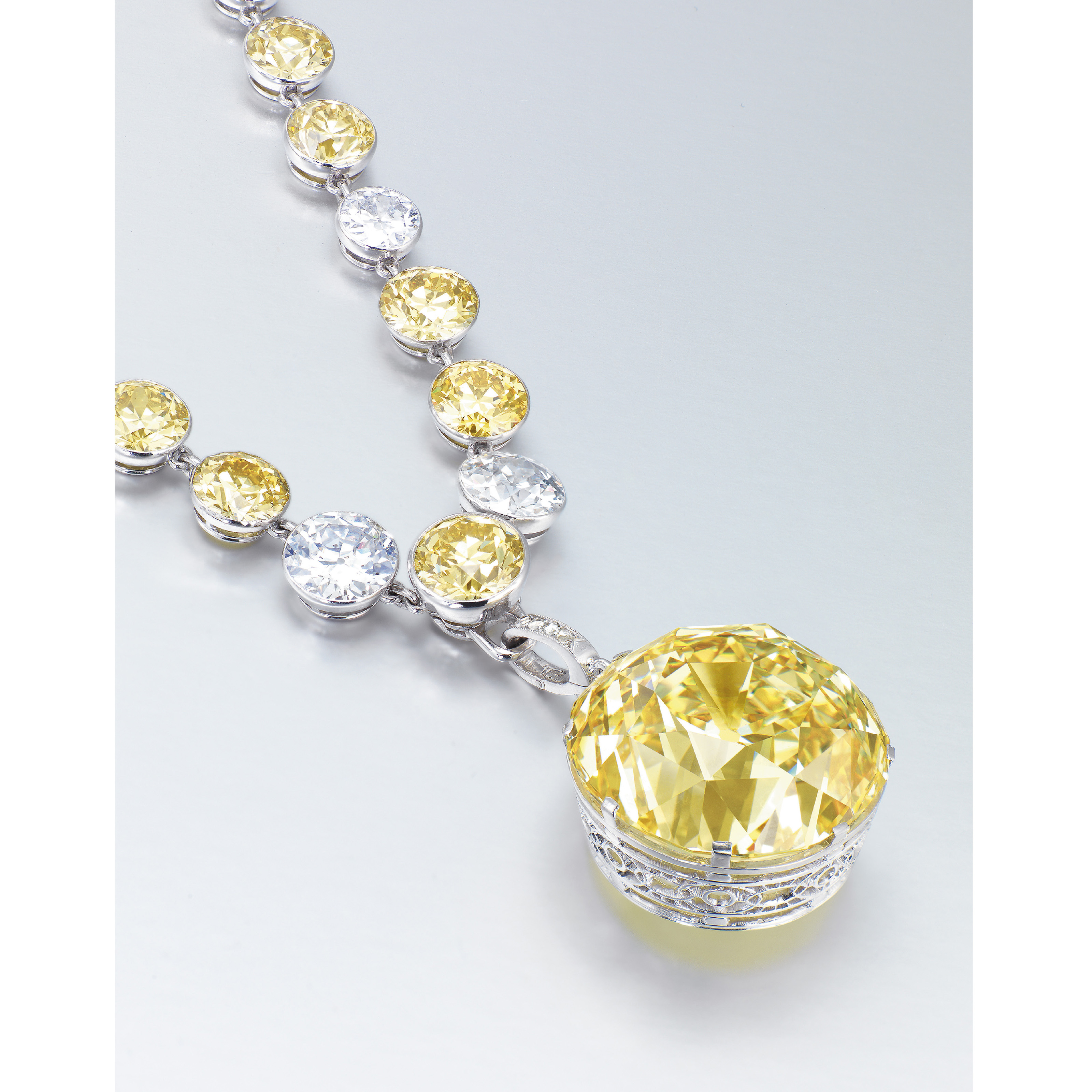 Image result for A UNIQUE BELLE ÃPOQUE COLOURED DIAMOND AND DIAMOND PENDANT NECKLACE
