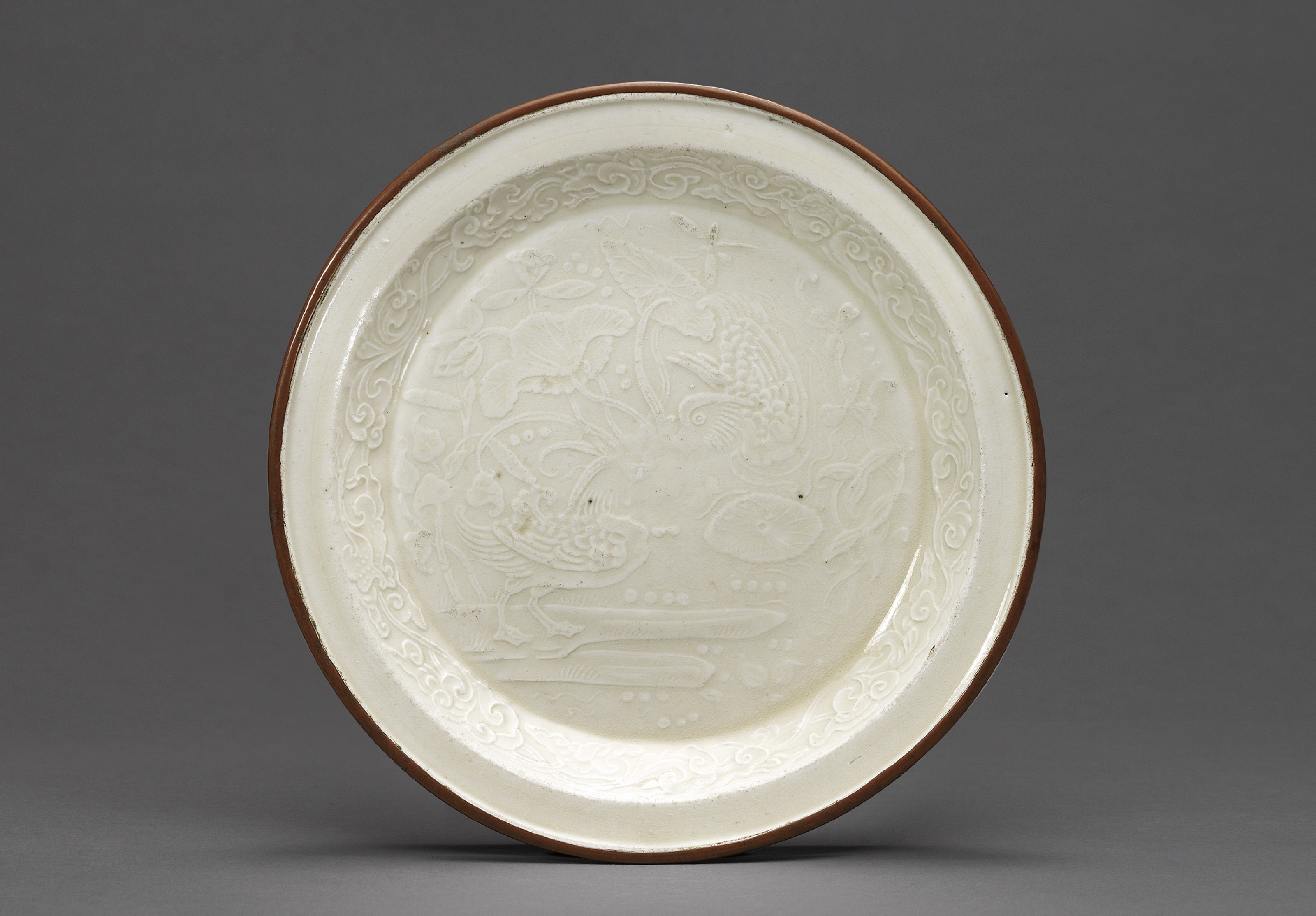 A RARE SMALL MOULDED 'MANDARIN DUCKS' DING DISH , JIN DYNASTY (1115