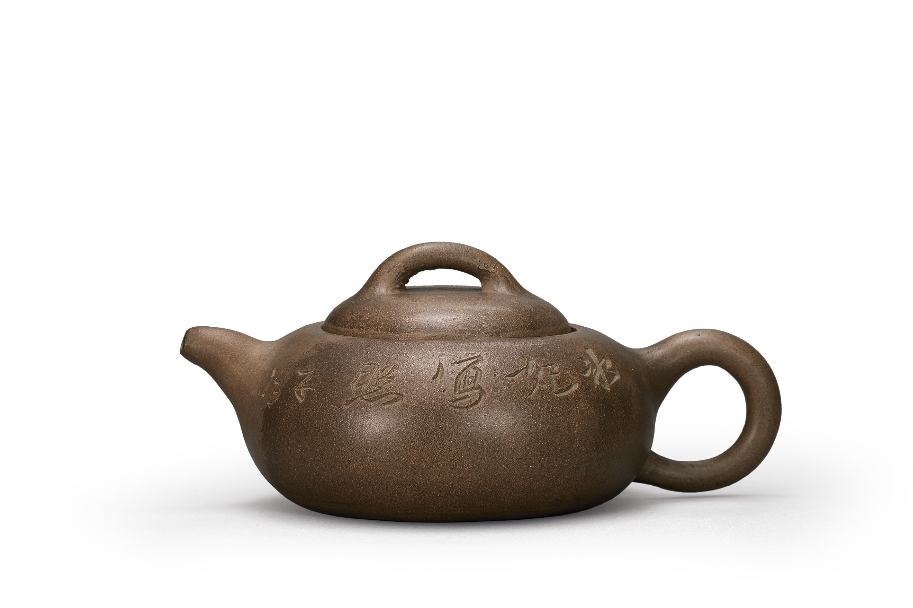 A CARVED 'PRUNUS' YIXING TEAPOT , QING DYNASTY, LATE 19TH CENTURY