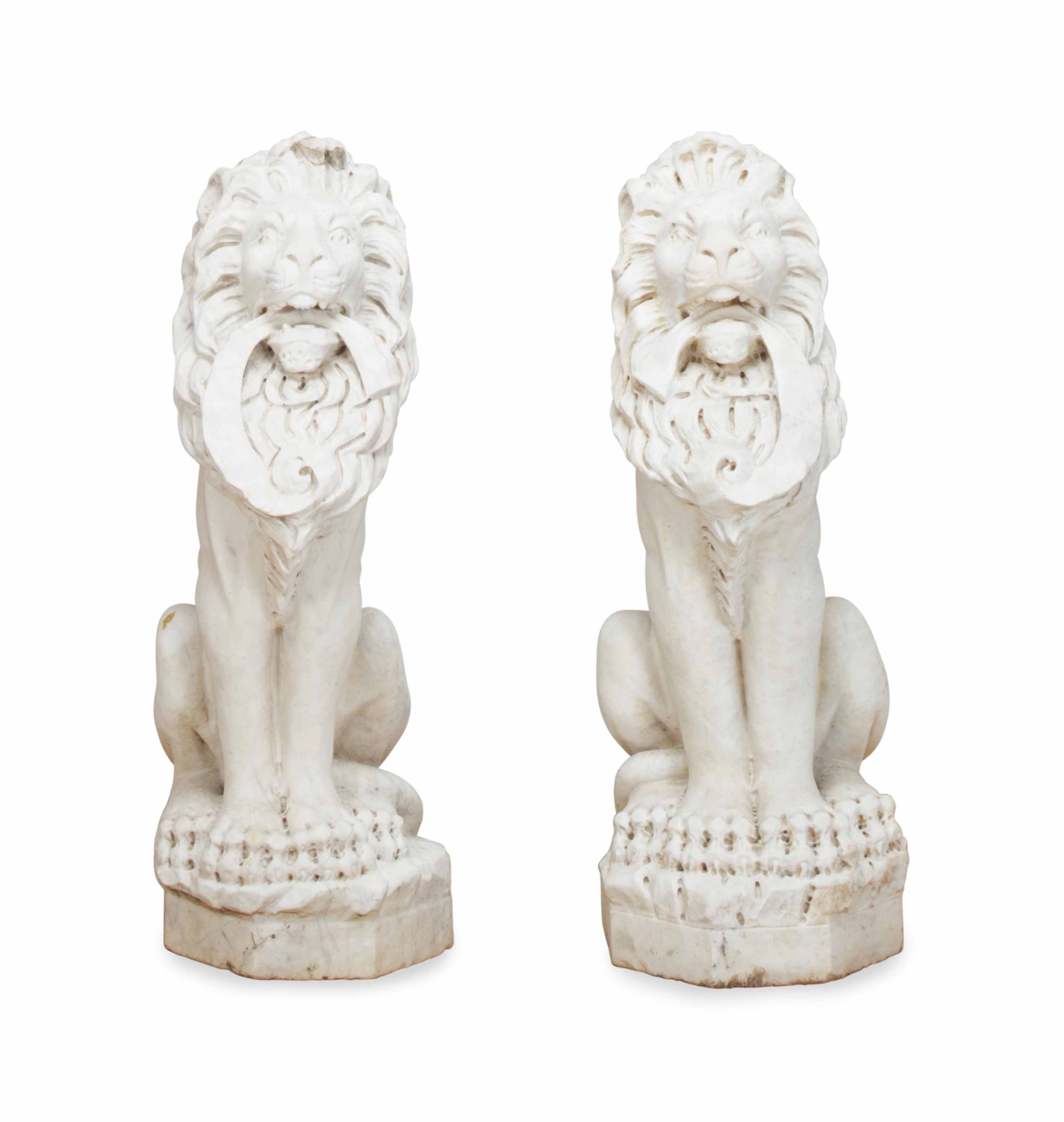 A PAIR OF MARBLE FIGURES OF SEATED LIONS, , LATE 20TH CENTURY Christie's