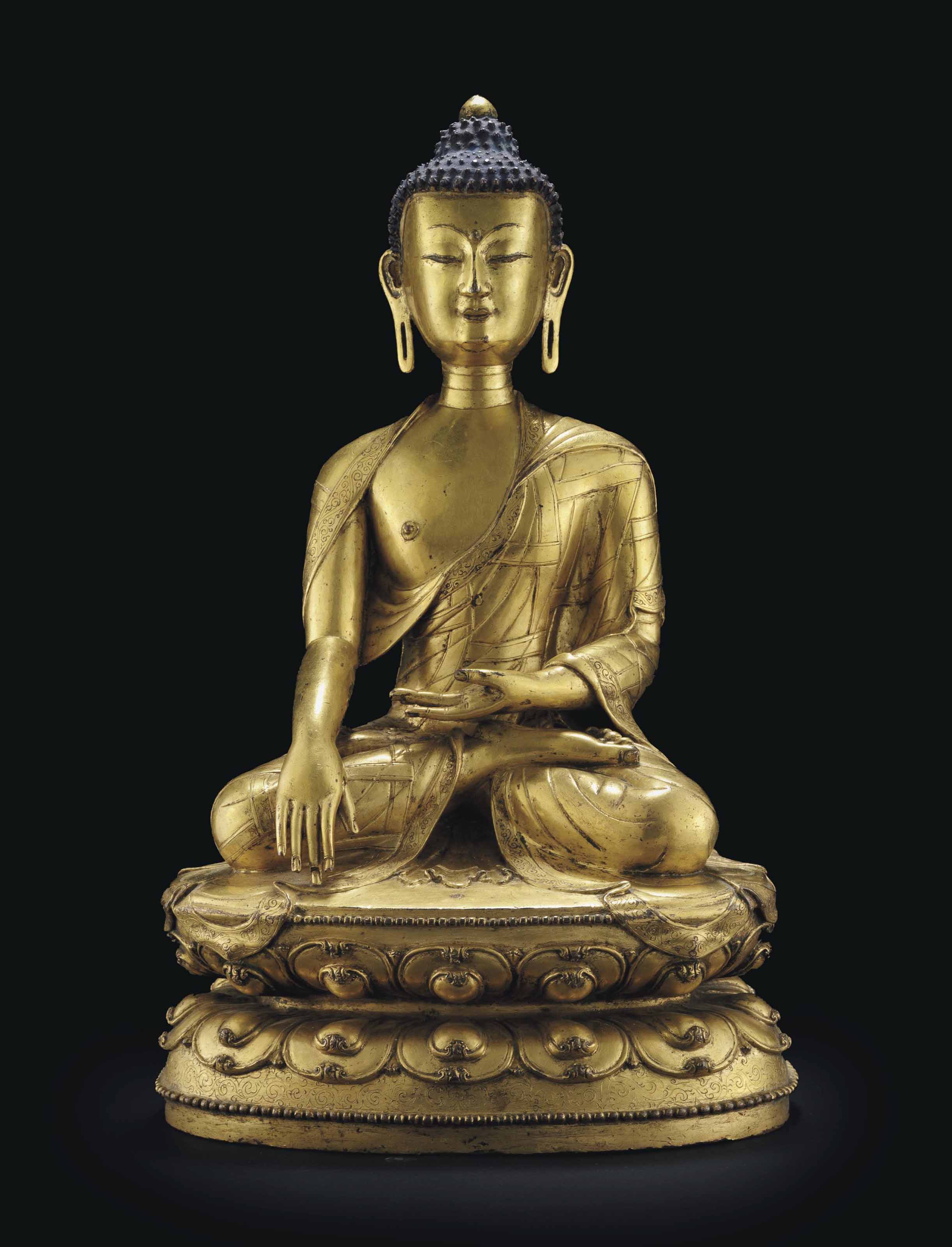 A gilt bronze figure of Buddha , TIBET, 15TH/16TH CENTURY Christie's