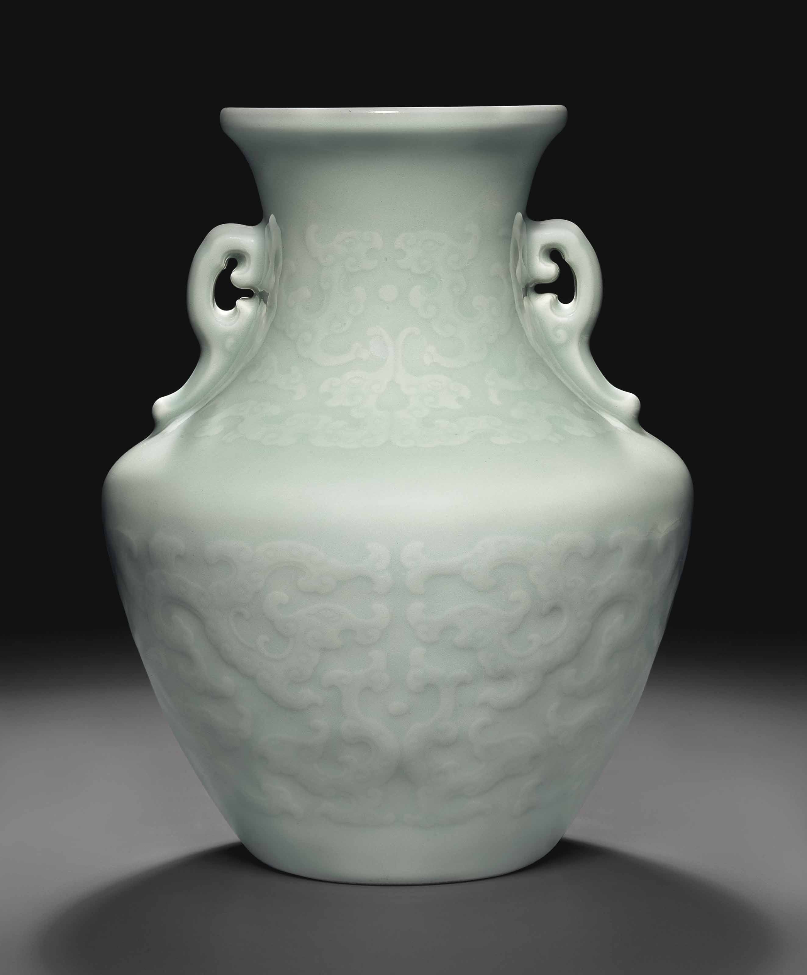 A RARE CELADONGLAZED RELIEFDECORATED ARCHAISTIC VASE , QIANLONG SEAL