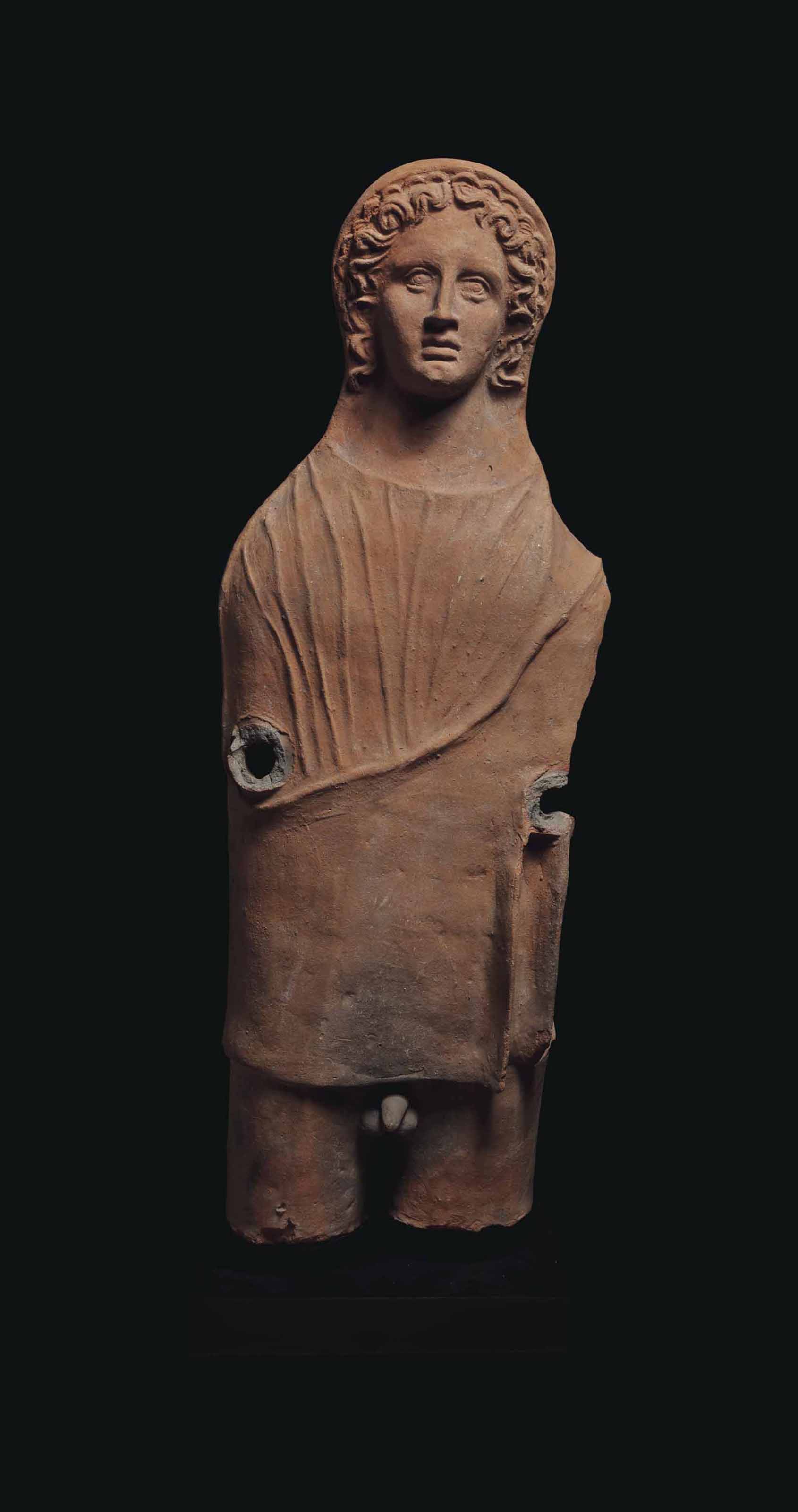 A LARGE ETRUSCAN TERRACOTTA VOTIVE STATUE , CIRCA LATE 3RDEARLY 2ND
