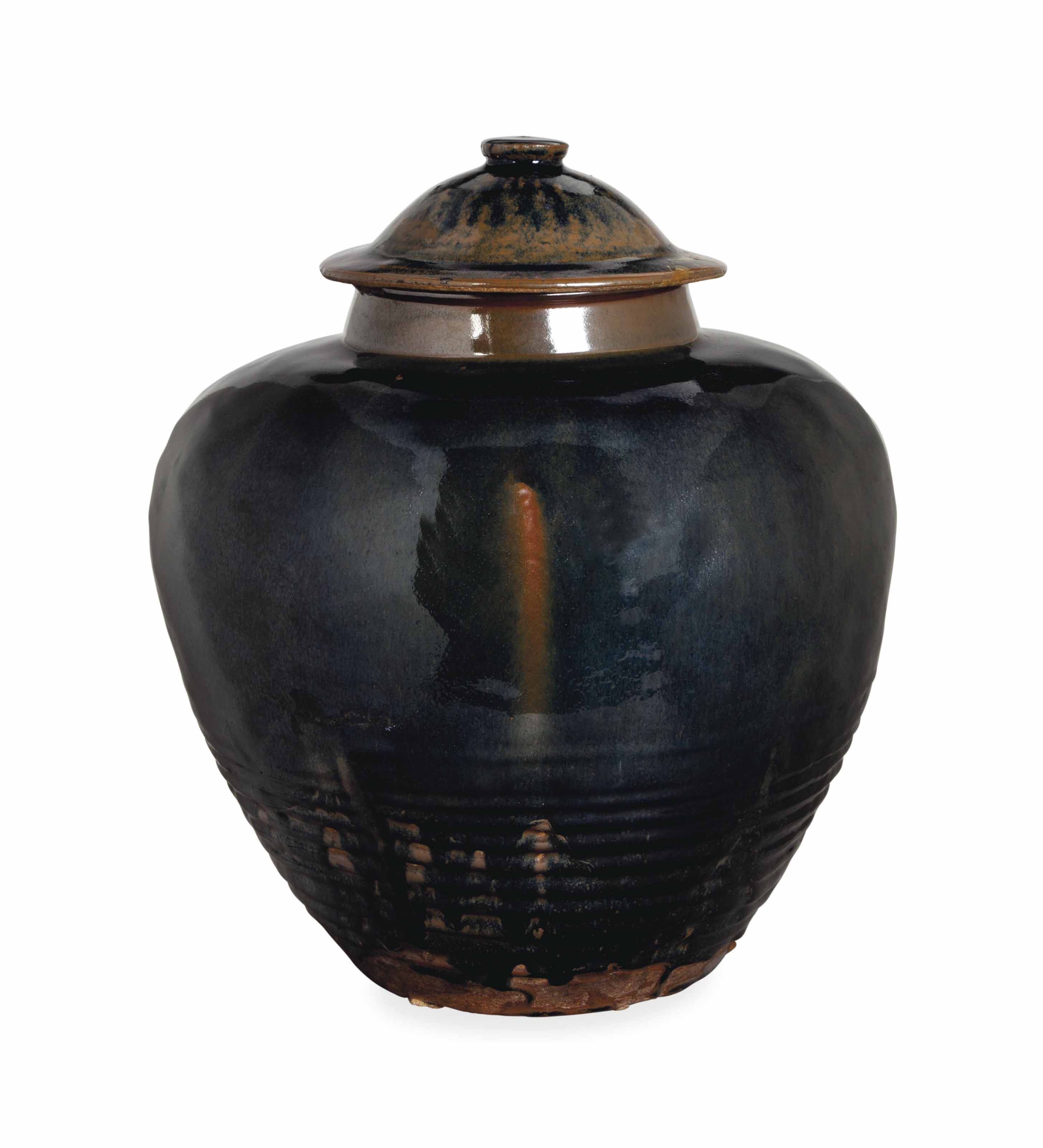 A BROWNGLAZED LARGE POTTERY JAR AND COVER