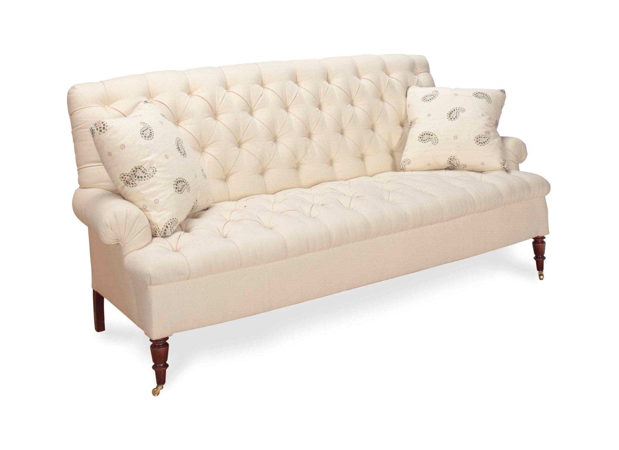 A CREAM TWILLUPHOLSTERED BUTTONTUFTED SOFA,