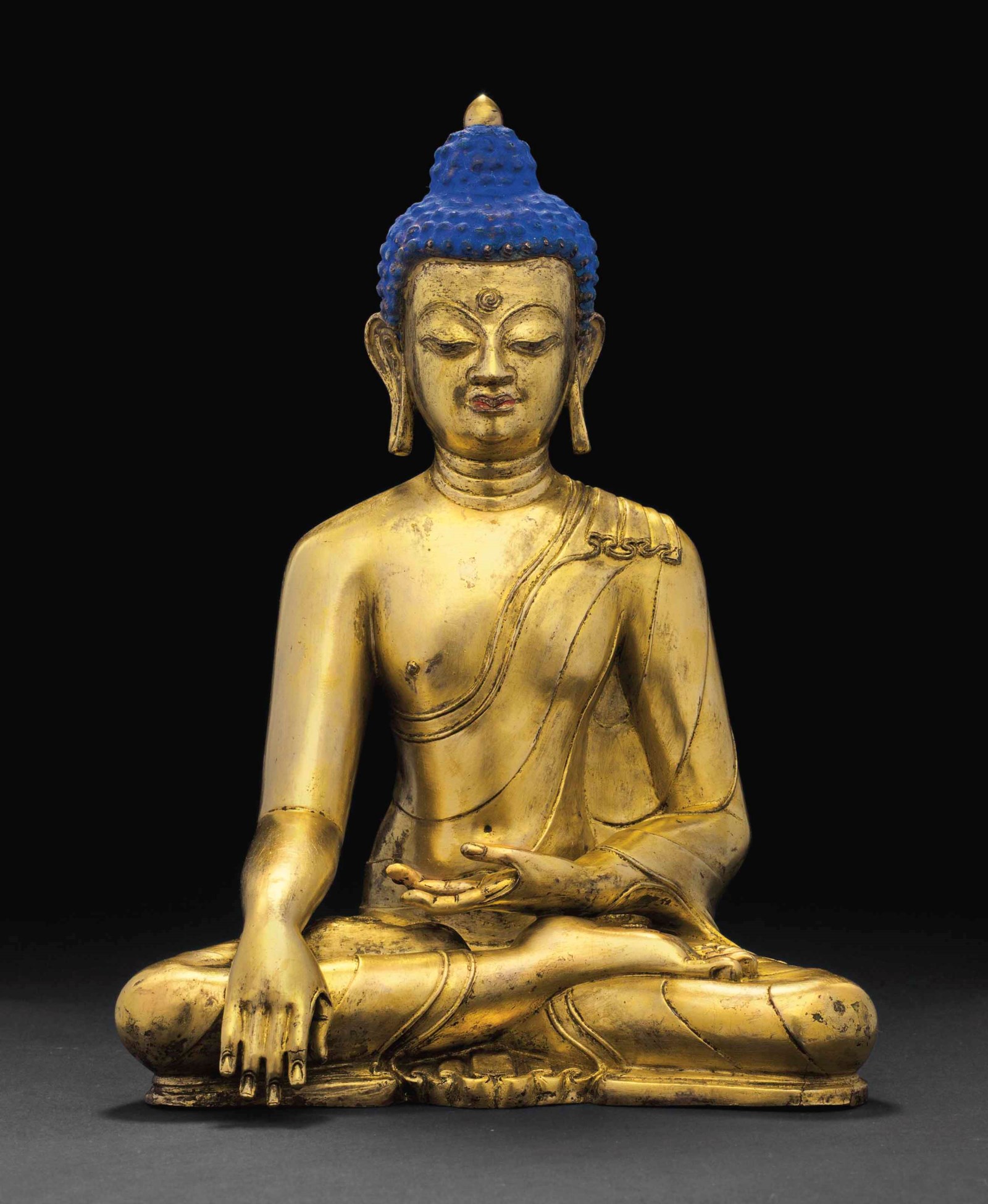An important gilt bronze figure of Buddha Shakyamuni
