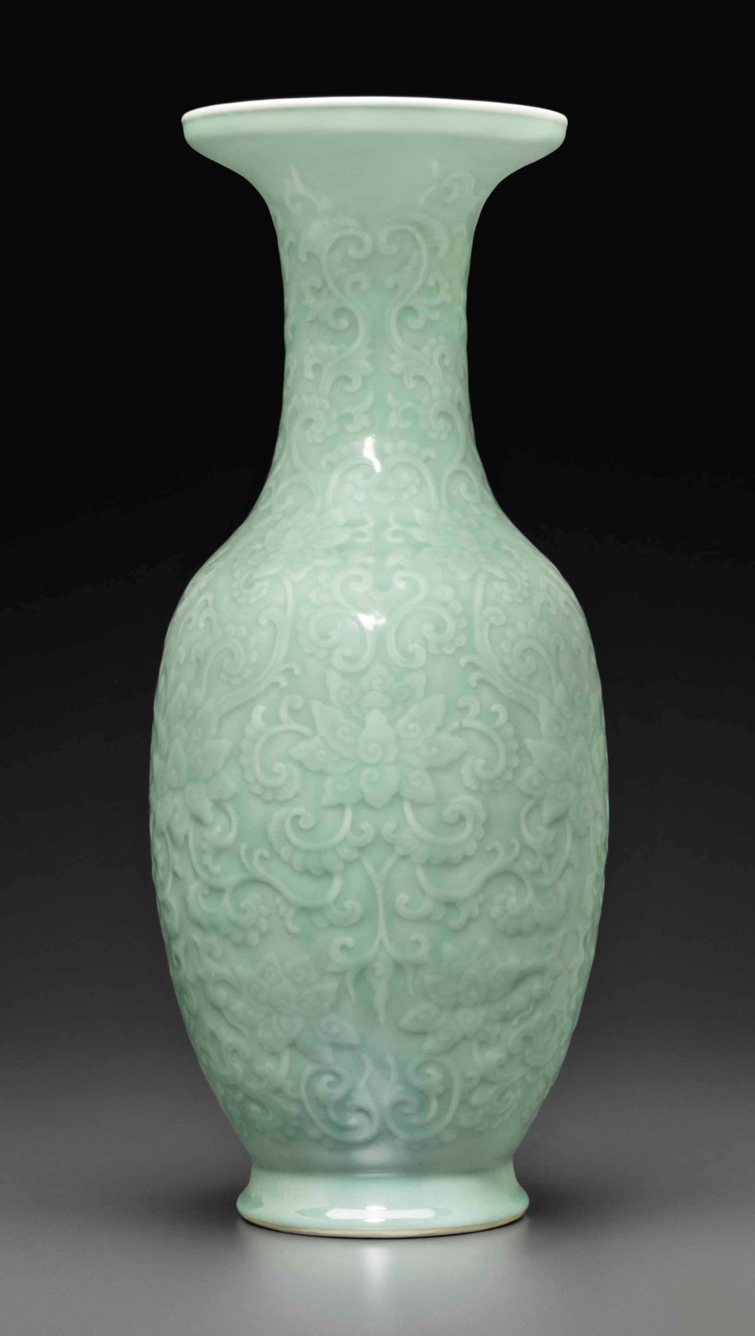 A CELADONGLAZED CARVED 'LOTUS' VASE, QIANLONG PERIOD (17361795