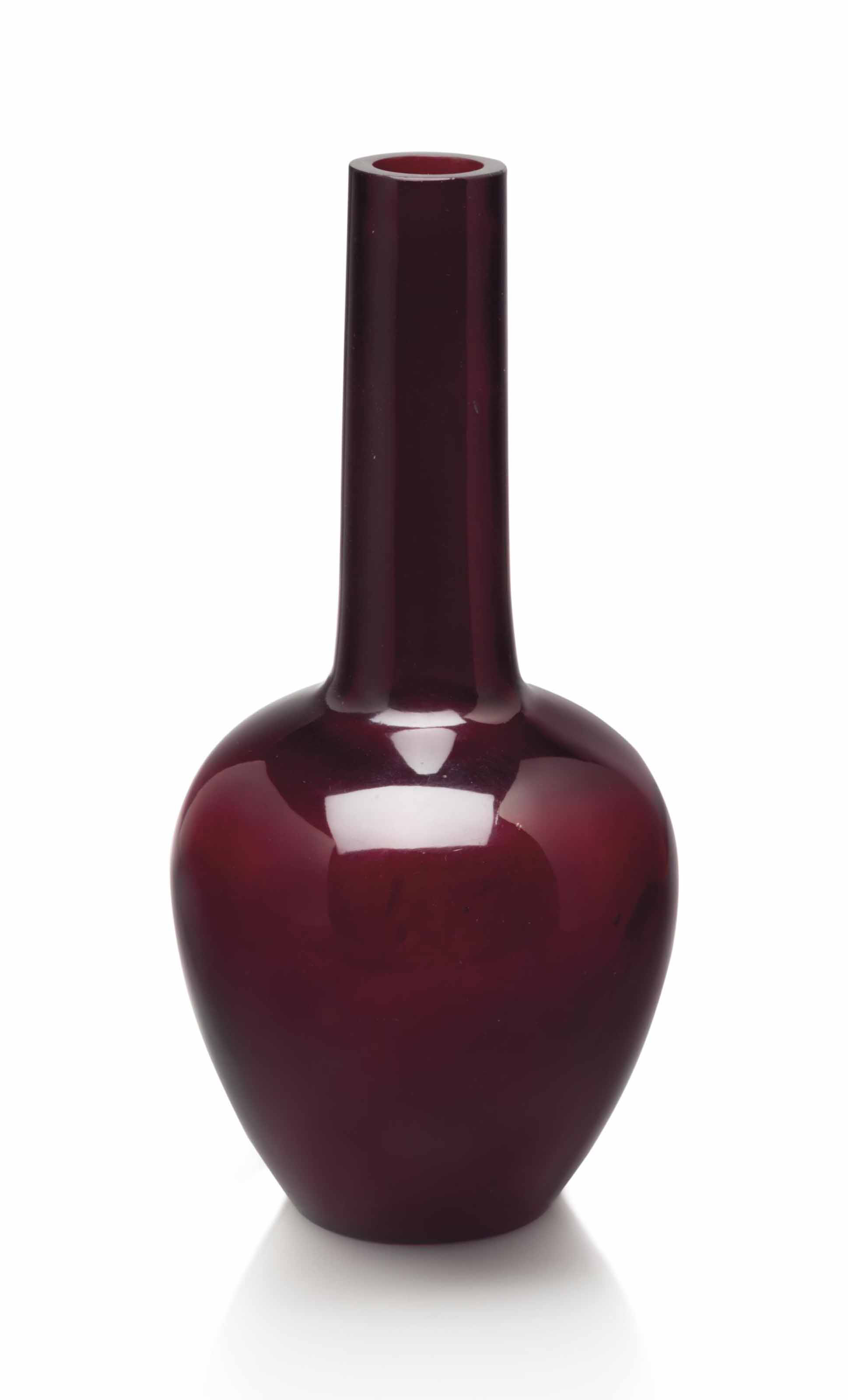 A TRANSPARENT DARK BURGUNDYRED GLASS BOTTLE VASE , QIANLONG FOUR