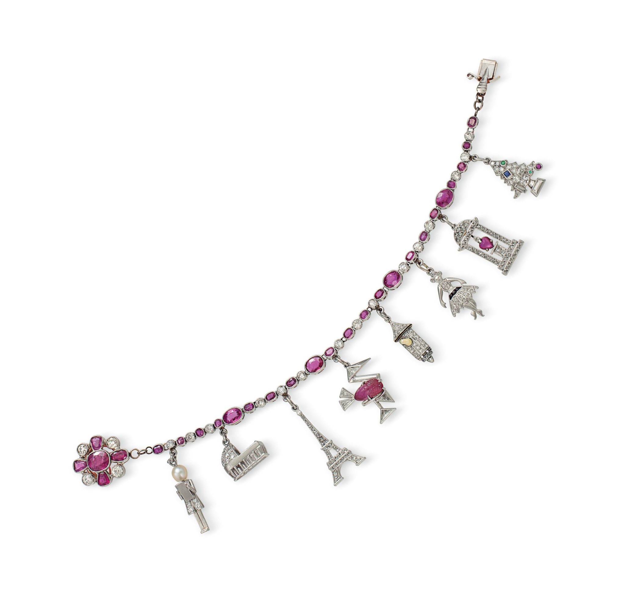 AN ART DECO DIAMOND AND RUBY CHARM BRACELET